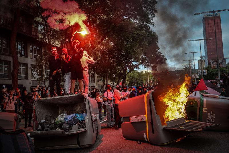 Activists on top of containers during a pro-Palestine demonstration in Barcelona