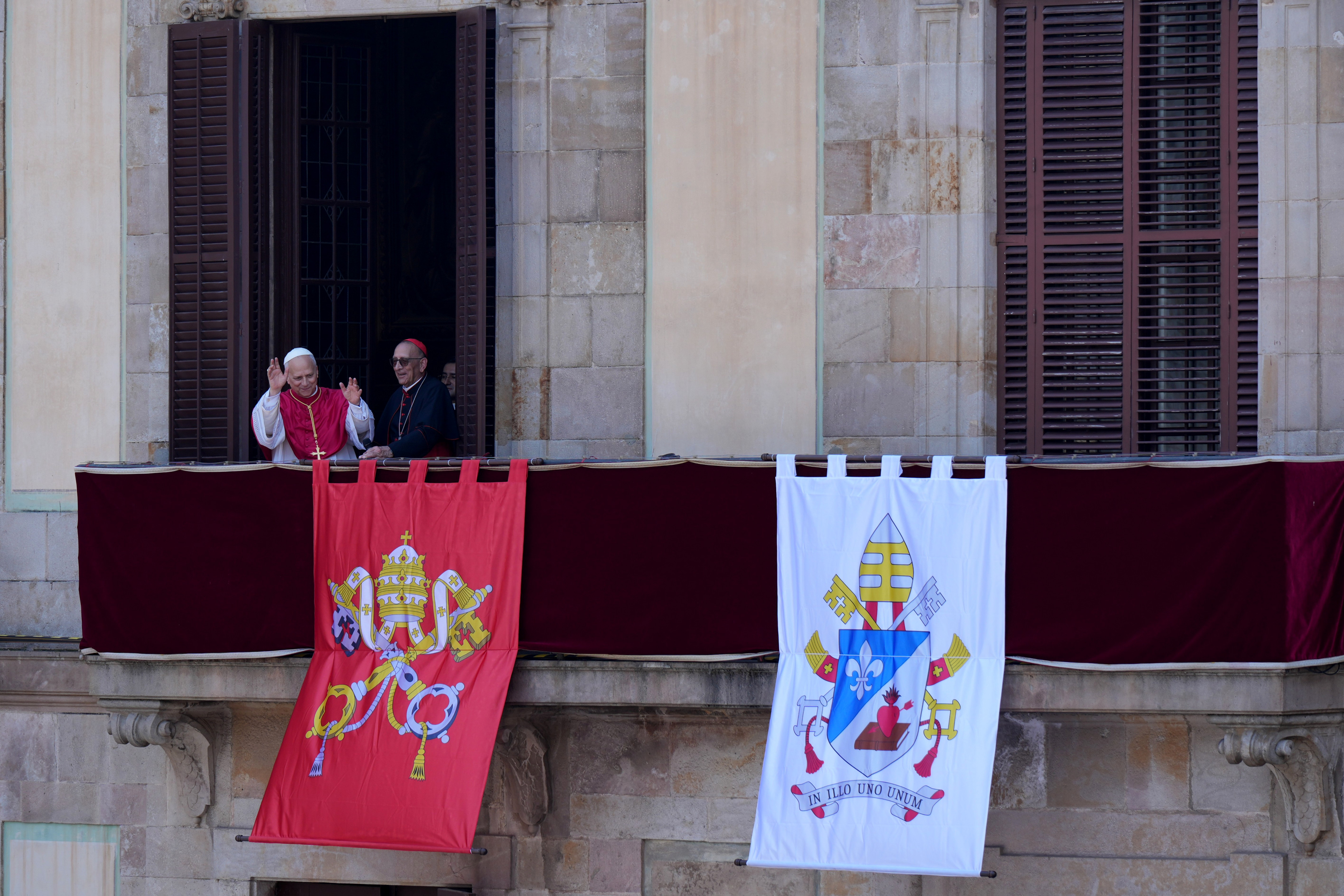 The Pope greets people from the balcony of the Episcopal Palace in Barcelona