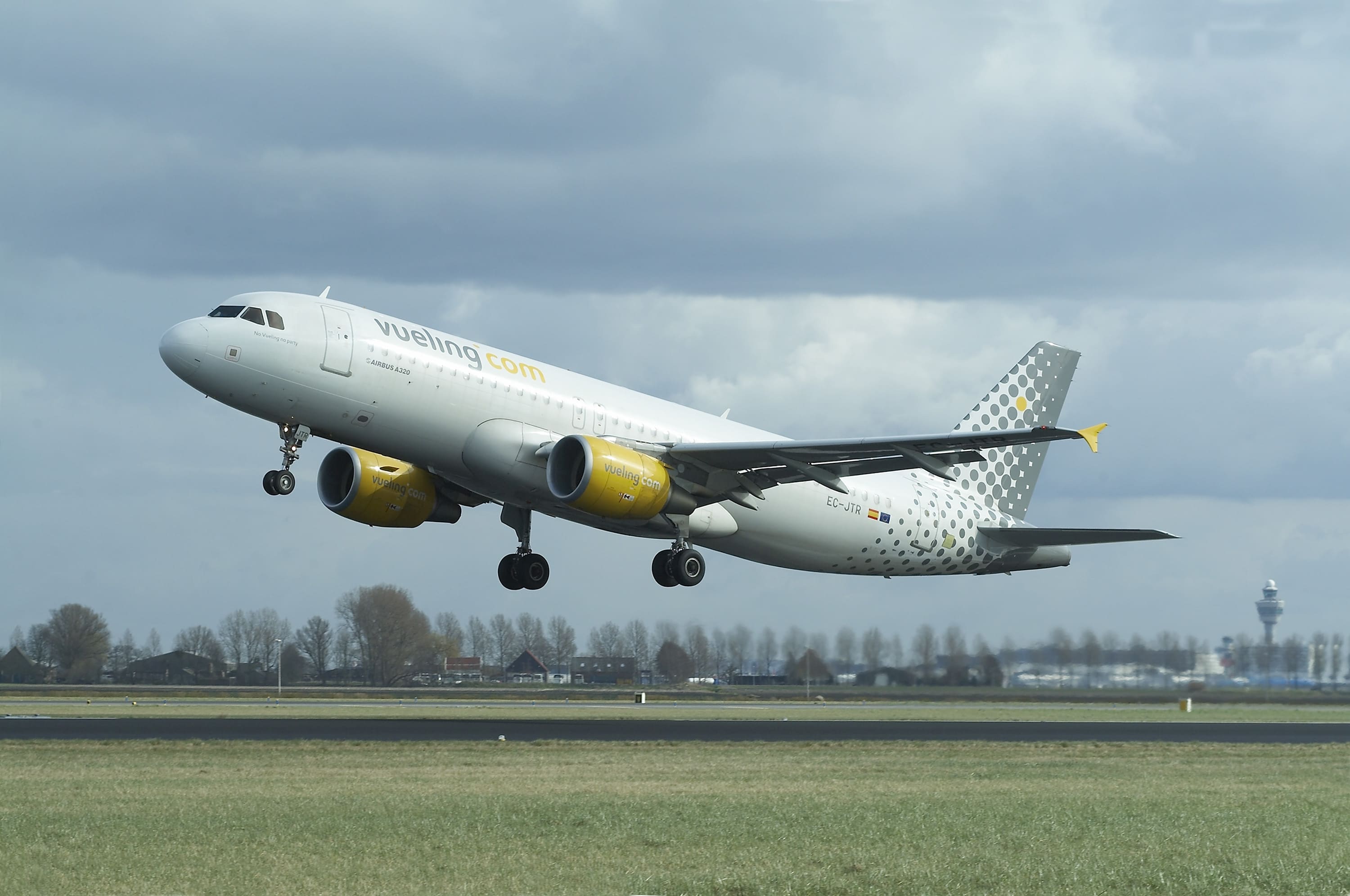 A Vueling Airbus A320 airplane taking off