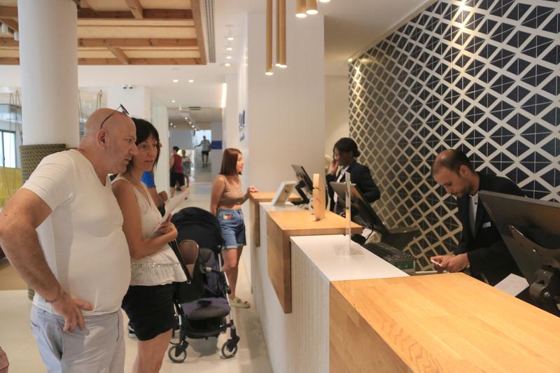 Tourists checking into a hotel in Salou