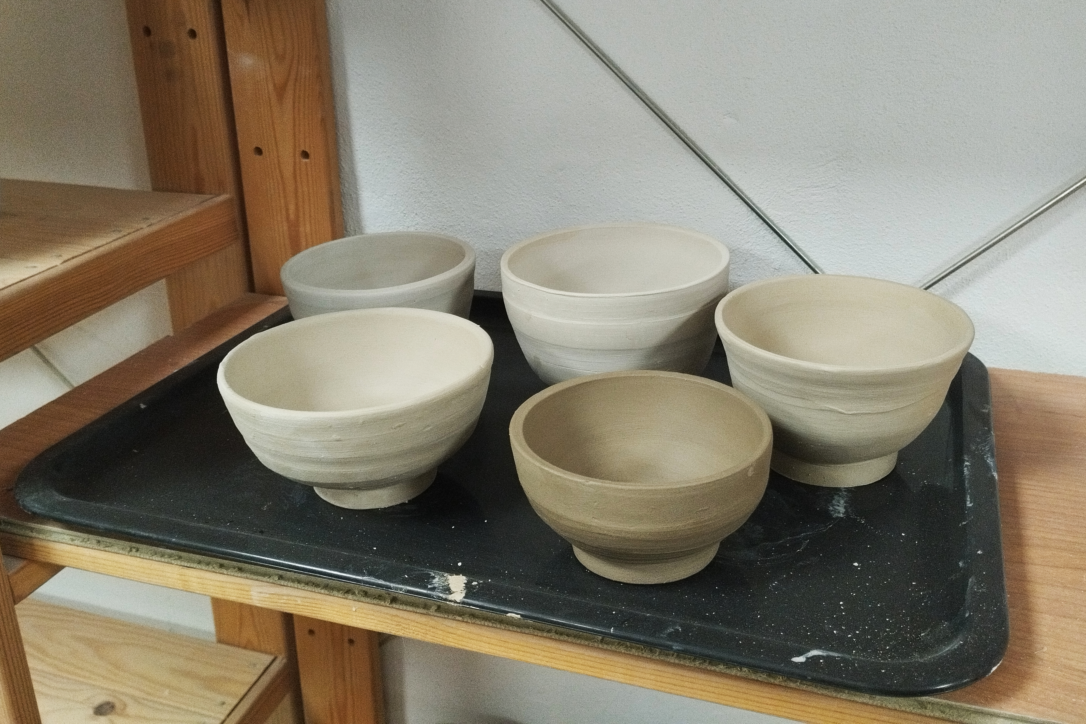 Artisanal ceramic pieces at Cova de Fang workshop