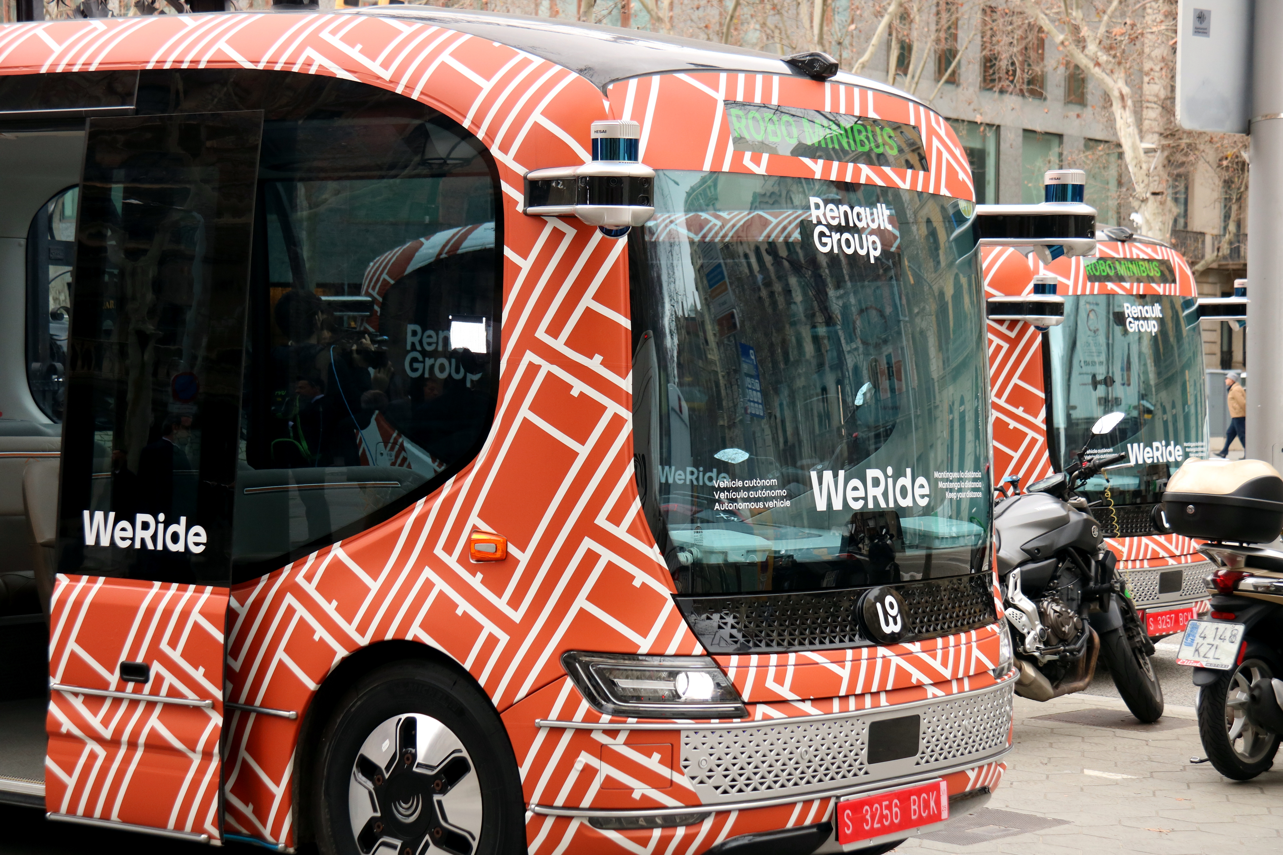 Two self-driving busses on Barcelona's Passeig de Gràcia