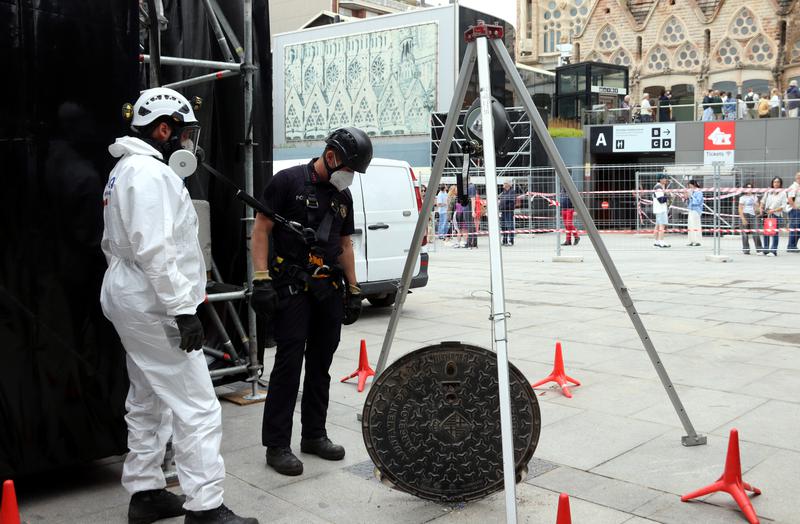 Mossos d'Esquadra police agents check the sewer system around the Sagrada Família ahead of the Pope's visit