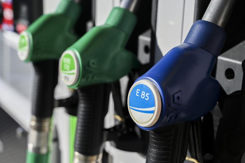 Several fuel hoses at a gas station