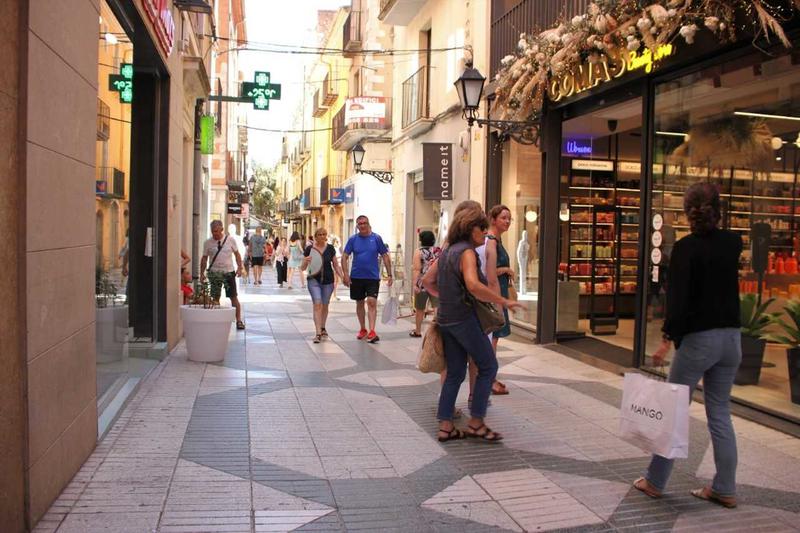 Some people going shopping in Figueres, northern Catalonia
