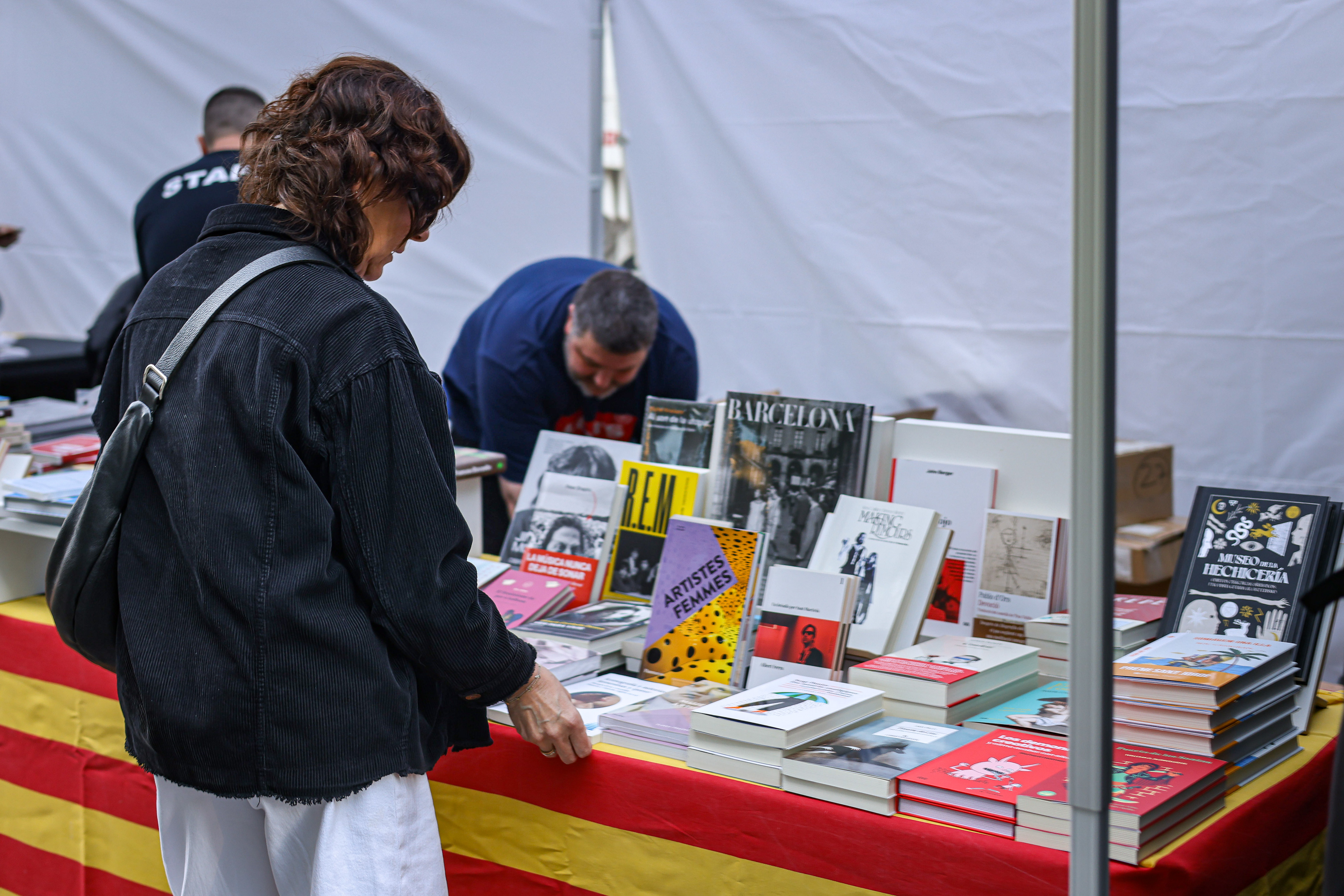 A woman at a book stall in Barcelona.