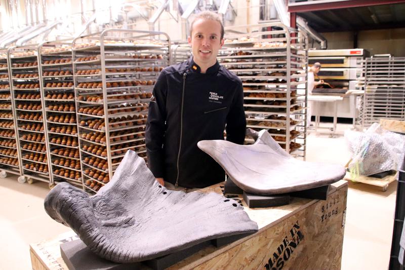 World's Best Master Chocolatier Lluc Crusellas poses with a replica of the elephant ears he created from chocolate as part of the Chocolate Masters competition