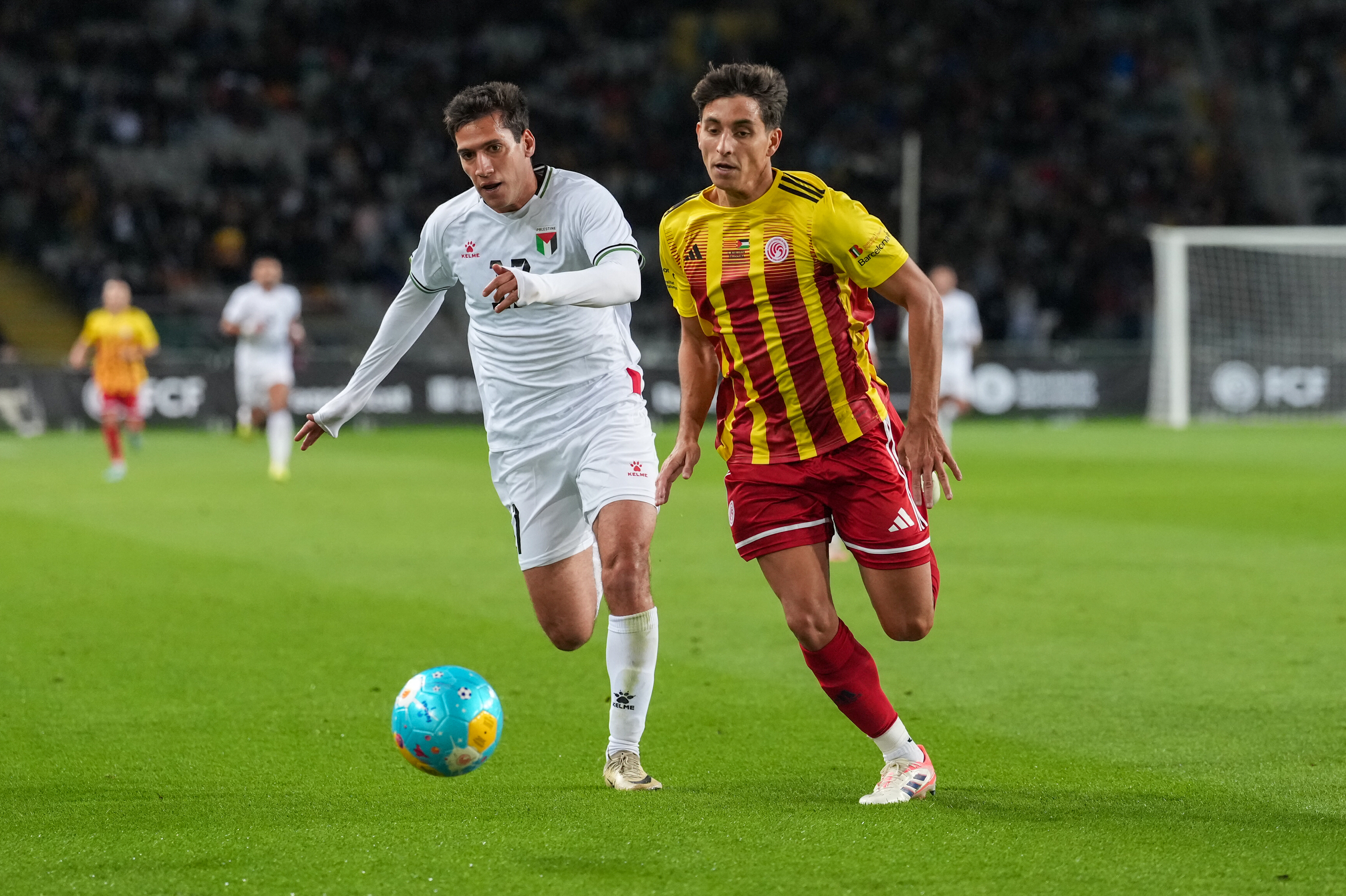 Action from the Catalonia-Palestine match at Barcelona’s Olympic Stadium