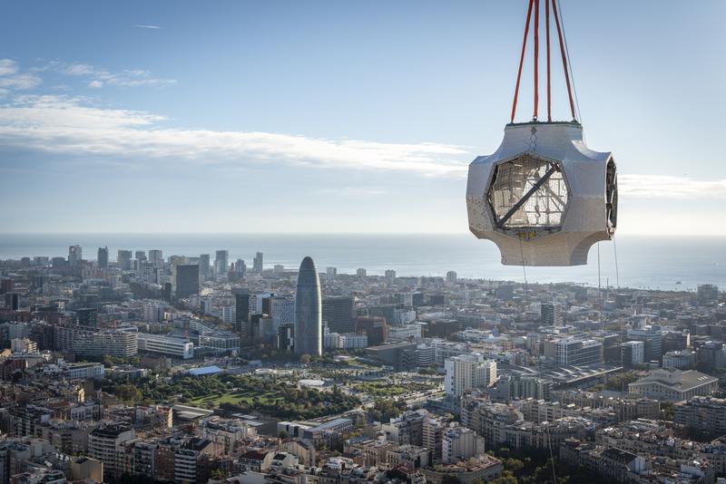 The central element of the cross atop the Sagrada Família’s Tower of Jesus Christ, during installation, with the Barcelona skyline in the background