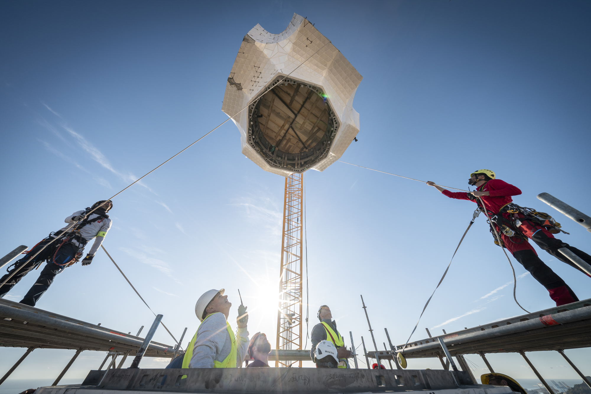 Workers installing the central element of the cross atop the Sagrada Família’s Tower of Jesus Christ