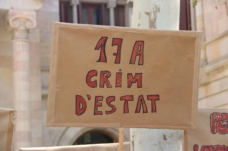 A protest sign accusing Spain of being behind the August 2017 terror attacks in Barcelona and Cambrils