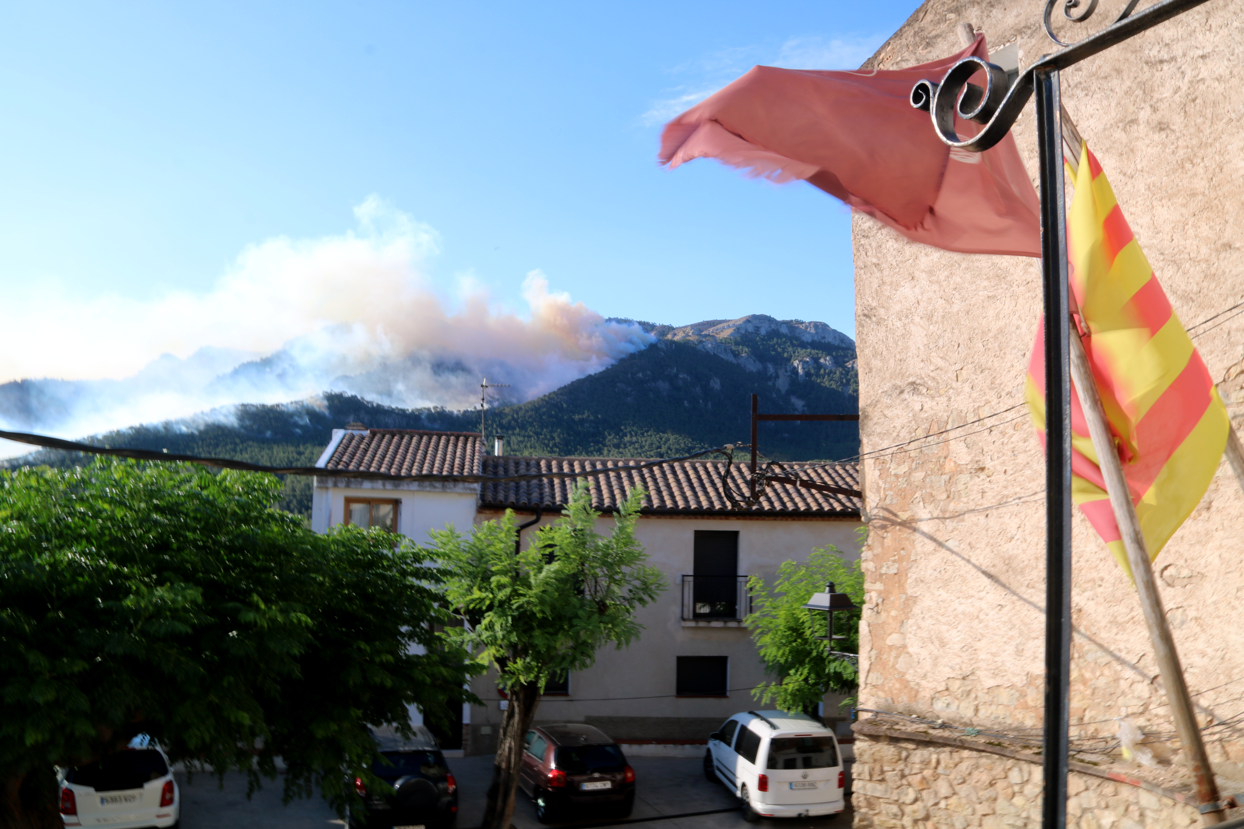 Smoke emerges from the Racó de l'Augueró area in Paüls, visible from the town's hall amid the wildfire burning the Ports Natural Park