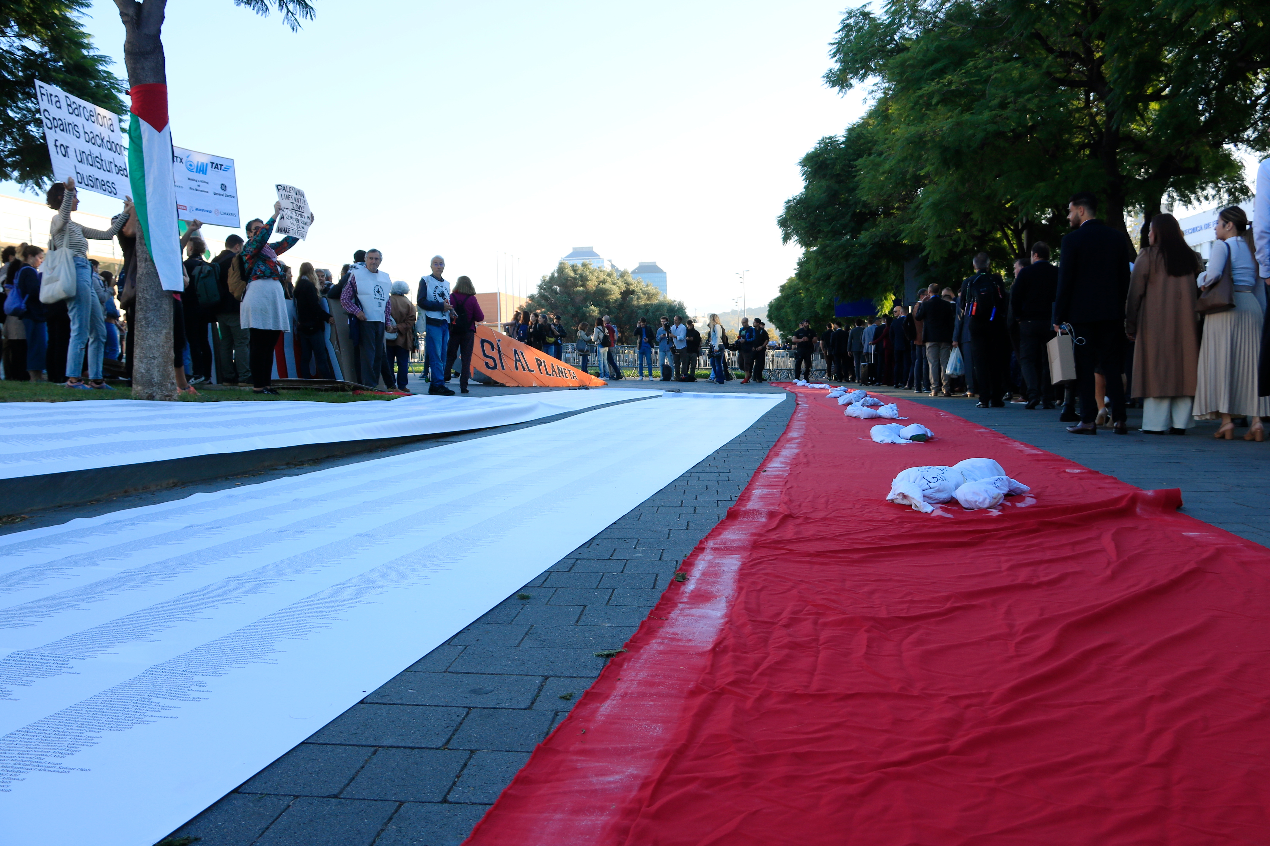 Red carpet with the sheets used to cover the bodies of the deceased.