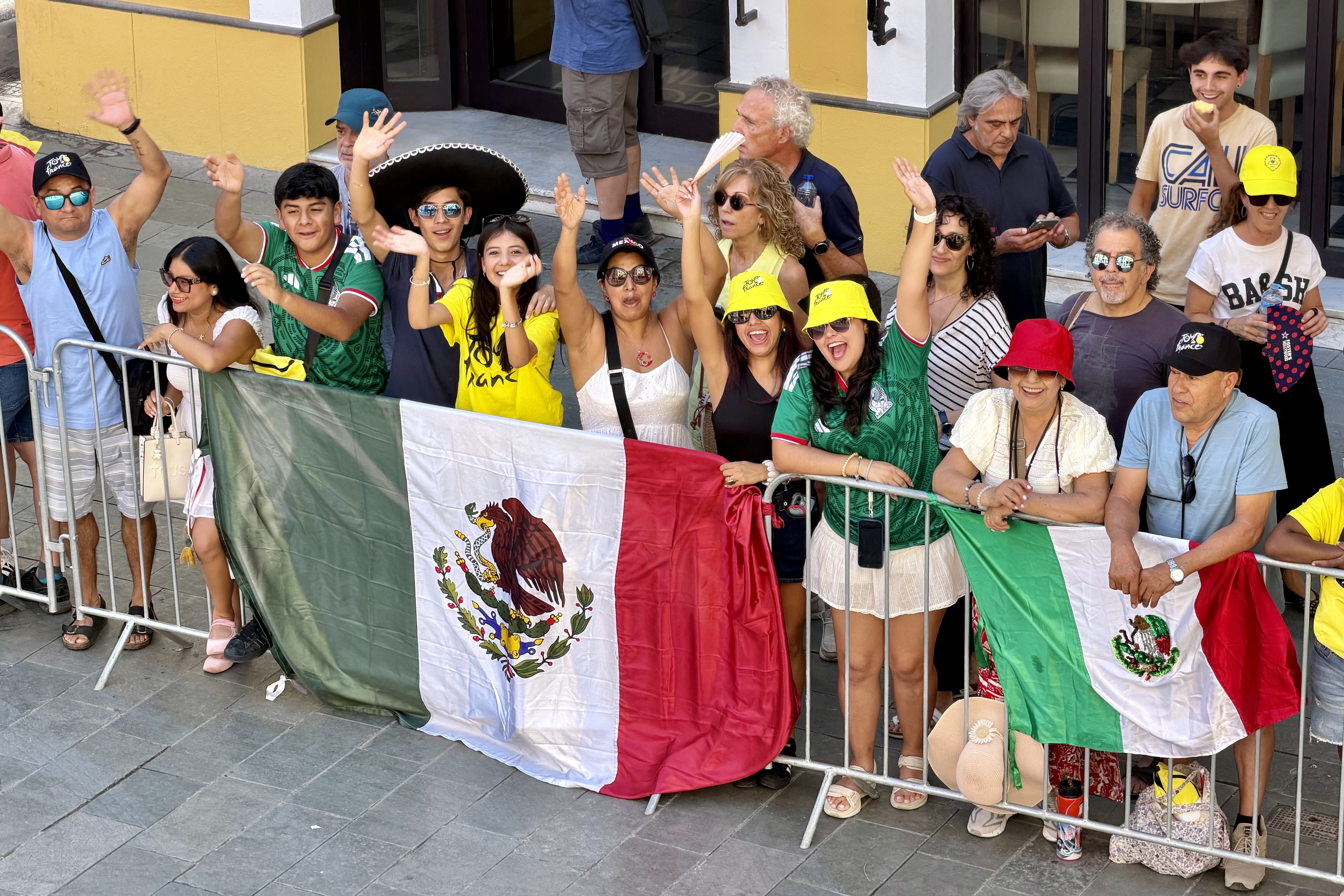 A group of Mexicans cheer on the Tour de France as they pass through the center of Granollers.