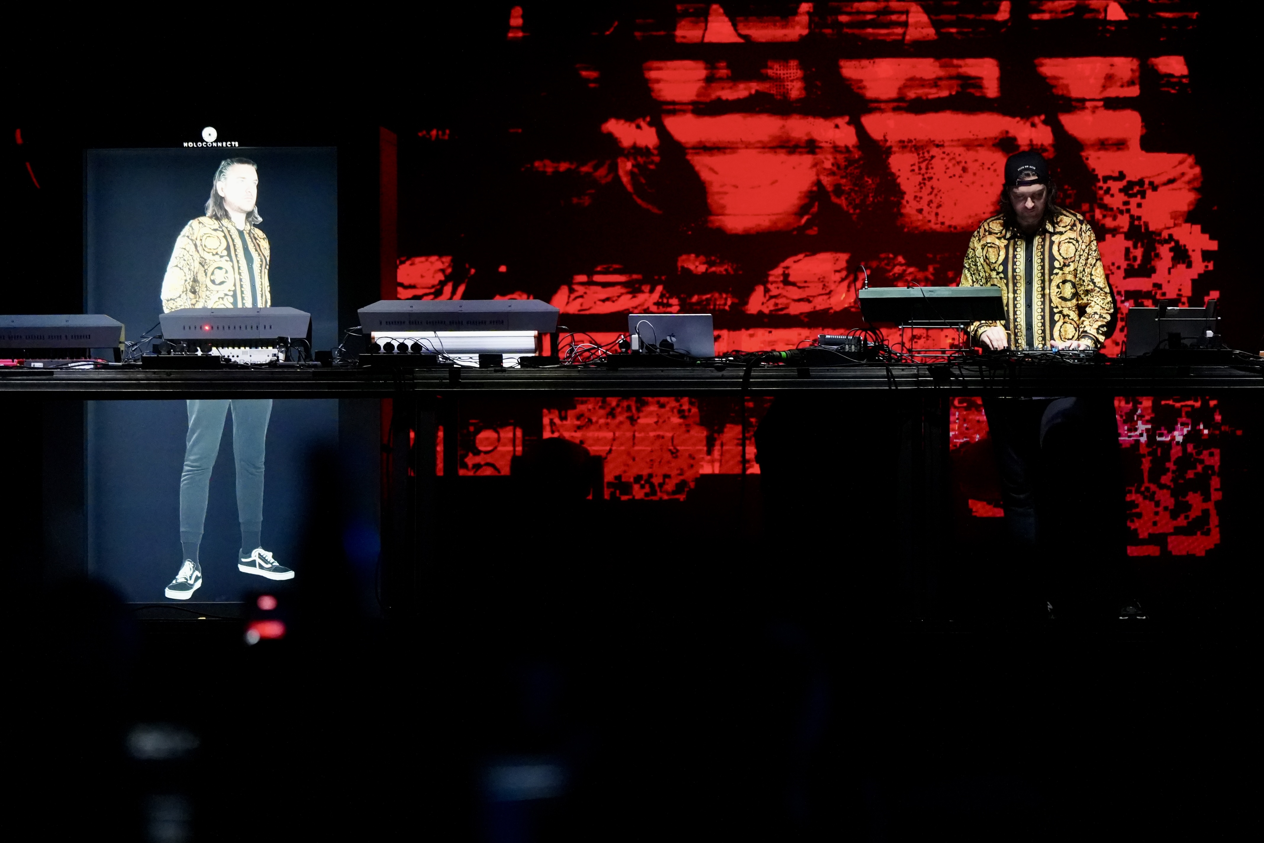 Reinier Zonneveld performs next to a hologram of himself