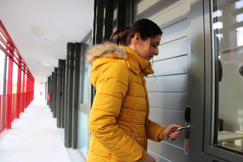 Djamila Bensabeur, a single mother enters her new home in APROP, a building made out of containers hosting 100 people in Barcelona's Glòries neighborhood on December 21, 2022