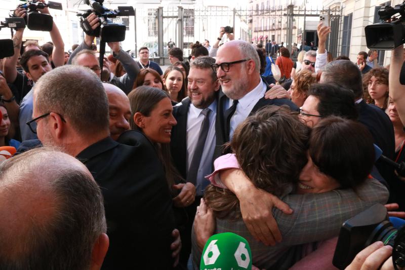 ERC and Junts MPs embrace one another after the Spanish Congress approves the amnesty law