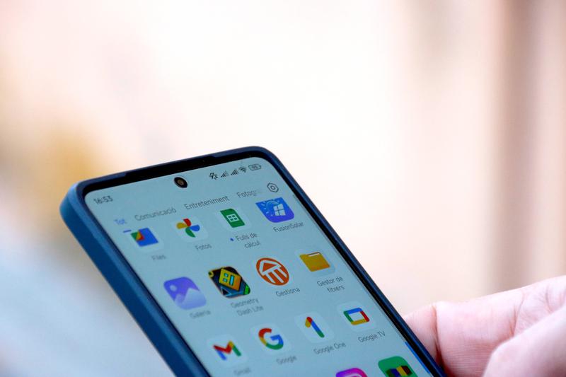 File image of a smartphone with app icons