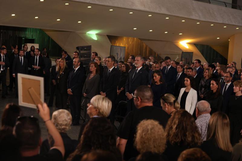 Relatives of Valencia DANA storm victims during the state funeral show pictures of their family members to Valencian president Carlos Mazón and Spanish authorities on October 29, 2025