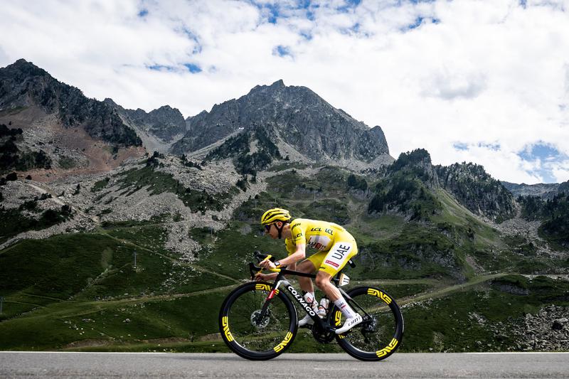 Tadej Pogacar wears the iconic yellow GC leader's jersey in the 2024 Tour de France stage 14