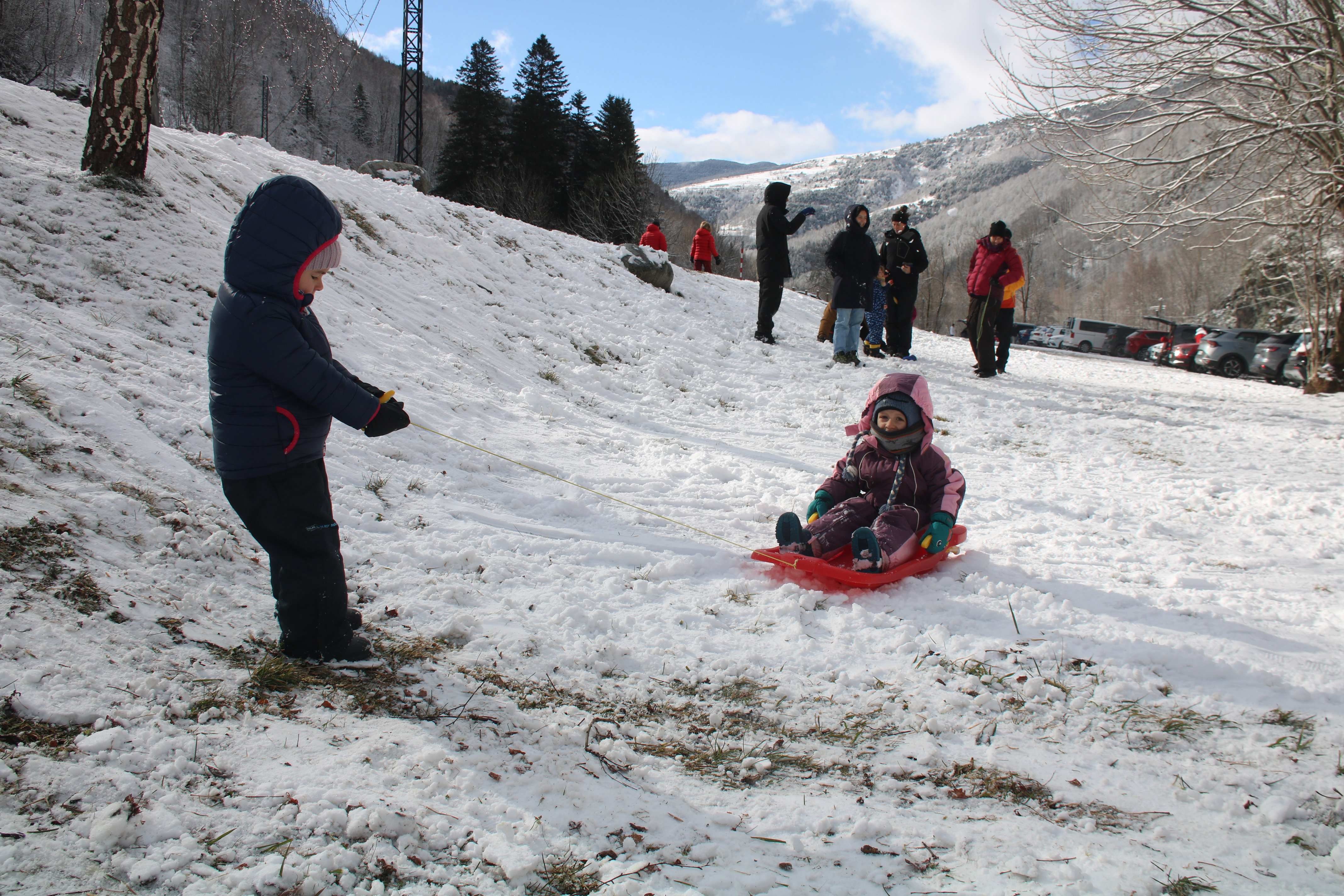 Children play after a snowfall in the municipality of Setcases in the Pyrenees on February 8, 2025