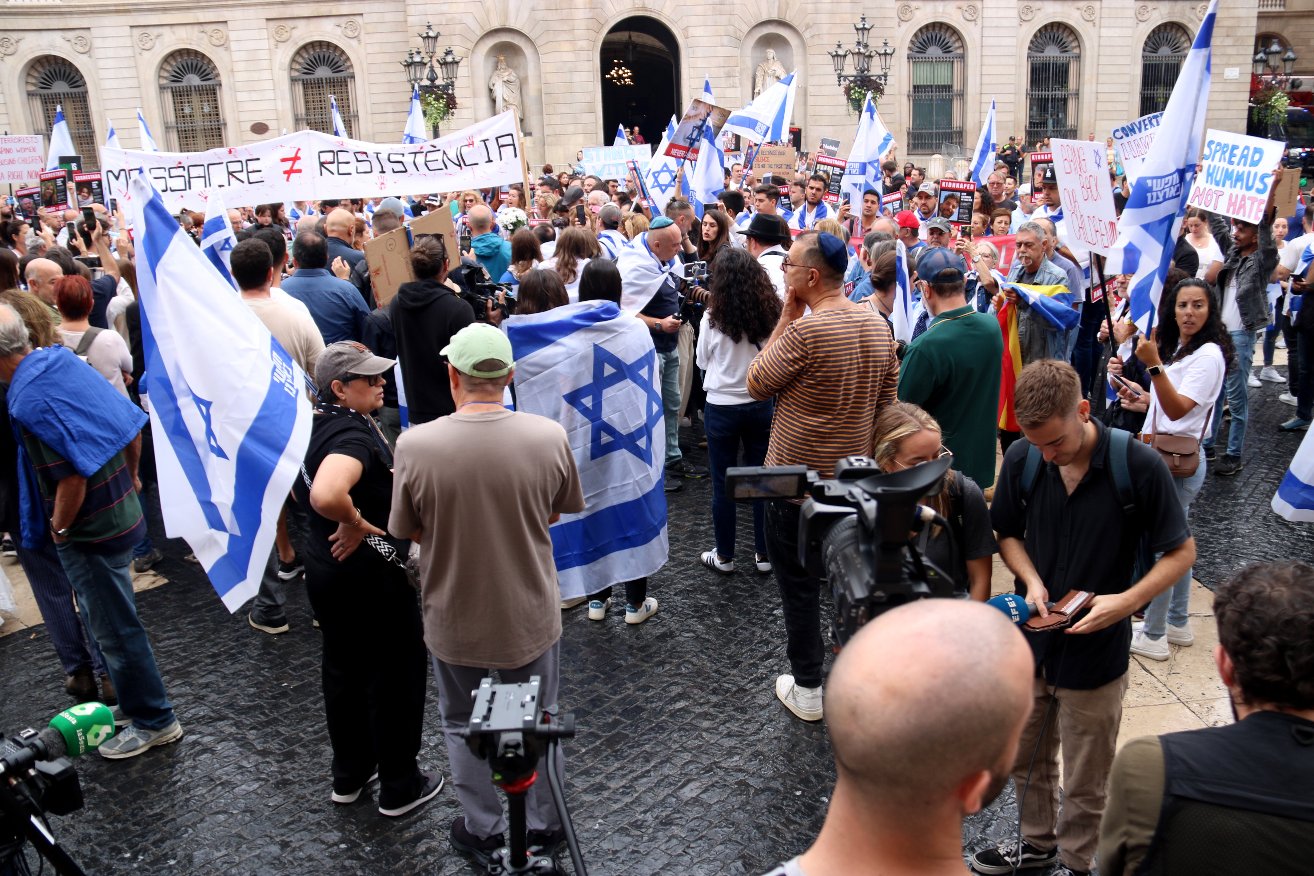 Several Israeli flags in a rally in Barcelona