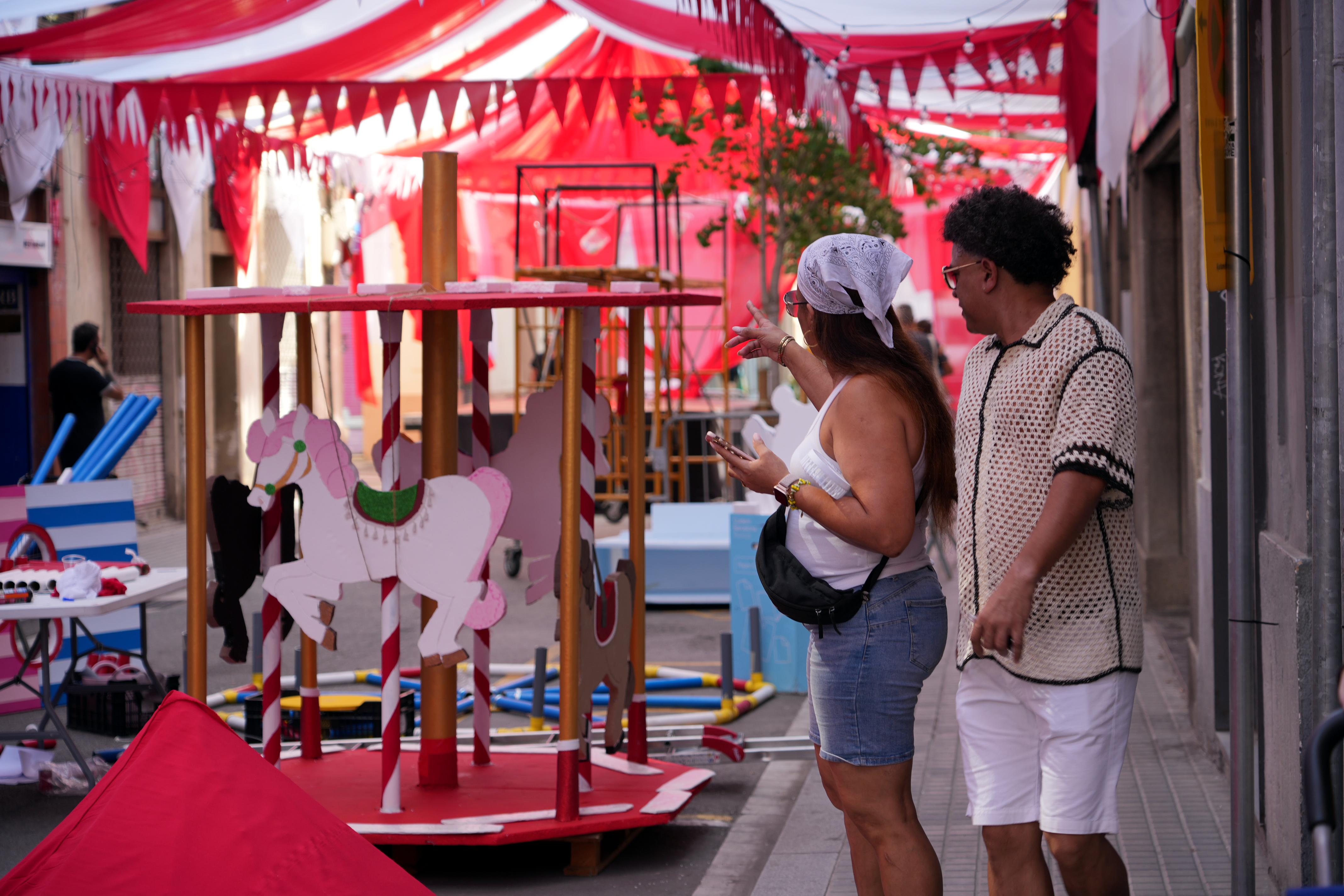 People visiting decorations in the neighbourhood of Gràcia