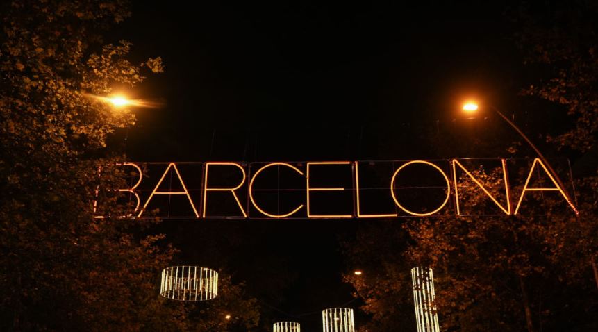 Barcelona written in red Christmas lights hanging on Gran Via boulevard