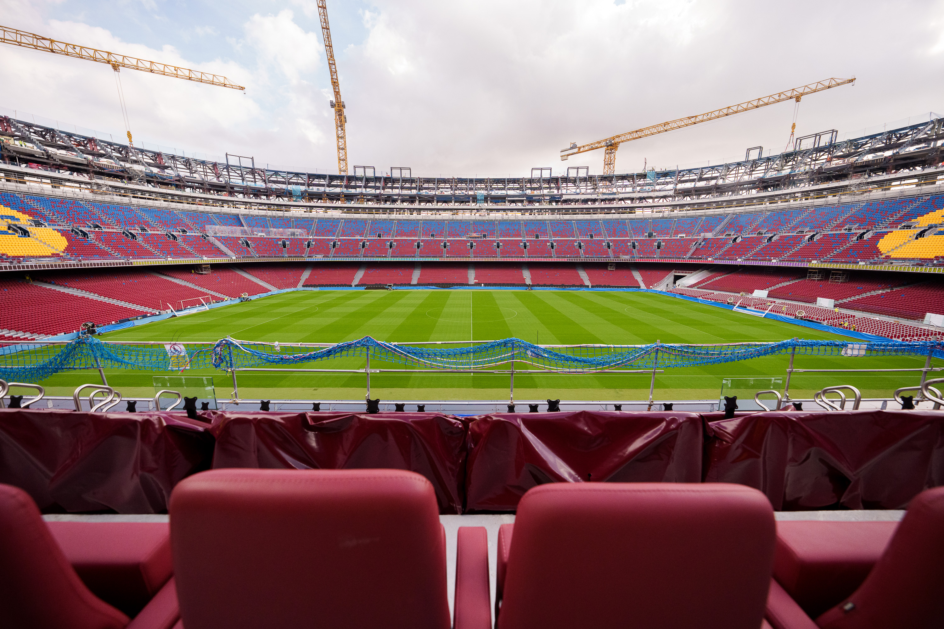 The VIP stands at FC Barcelona's Spotify Camp Nou with several cranes in the background
