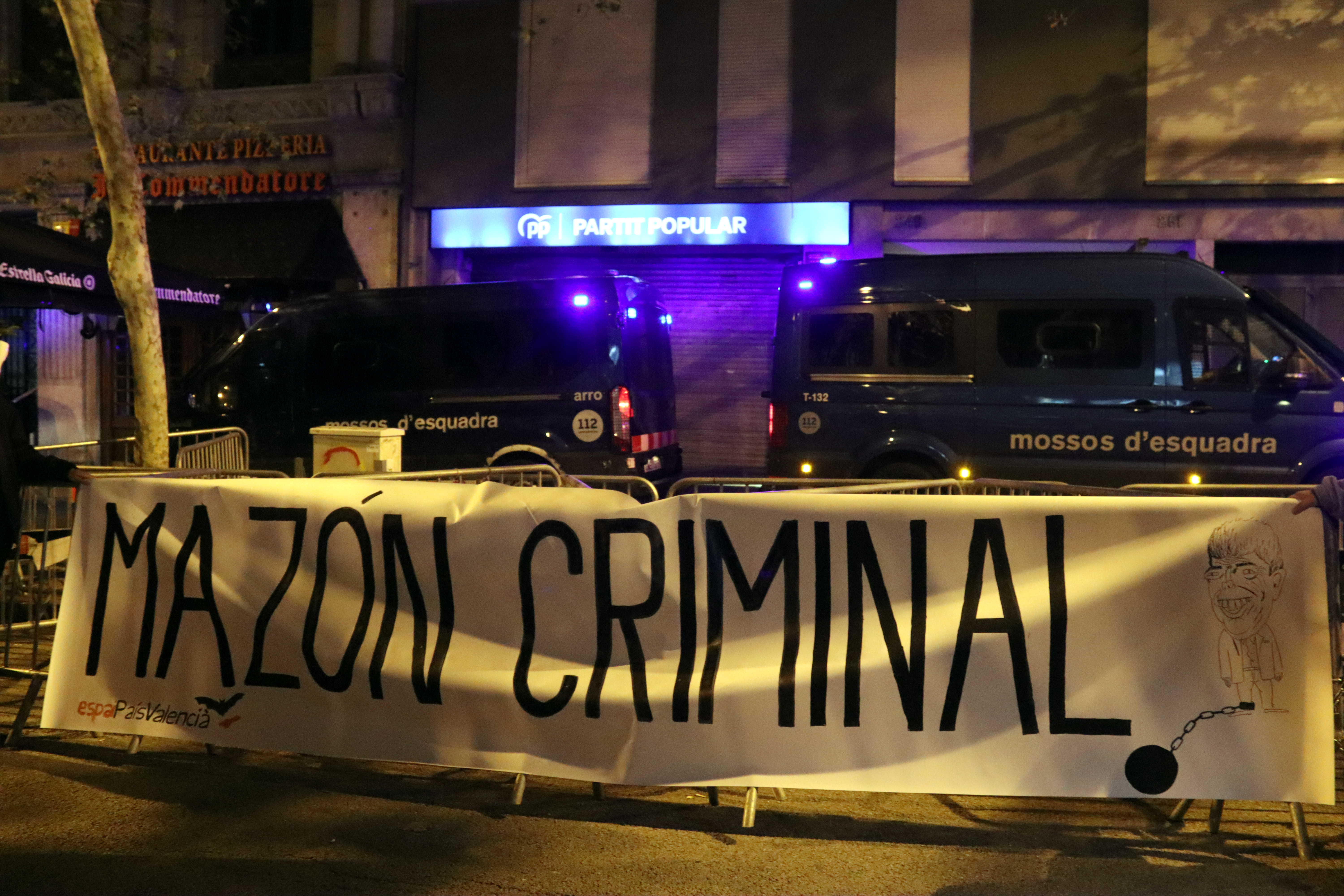 A banner calling Valencian regional president Carlos Mazón a criminal