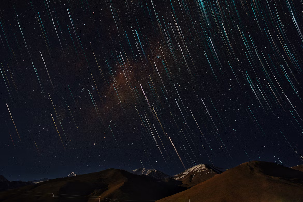 A time-lapse photo of dozens of shooting stars in the night sky