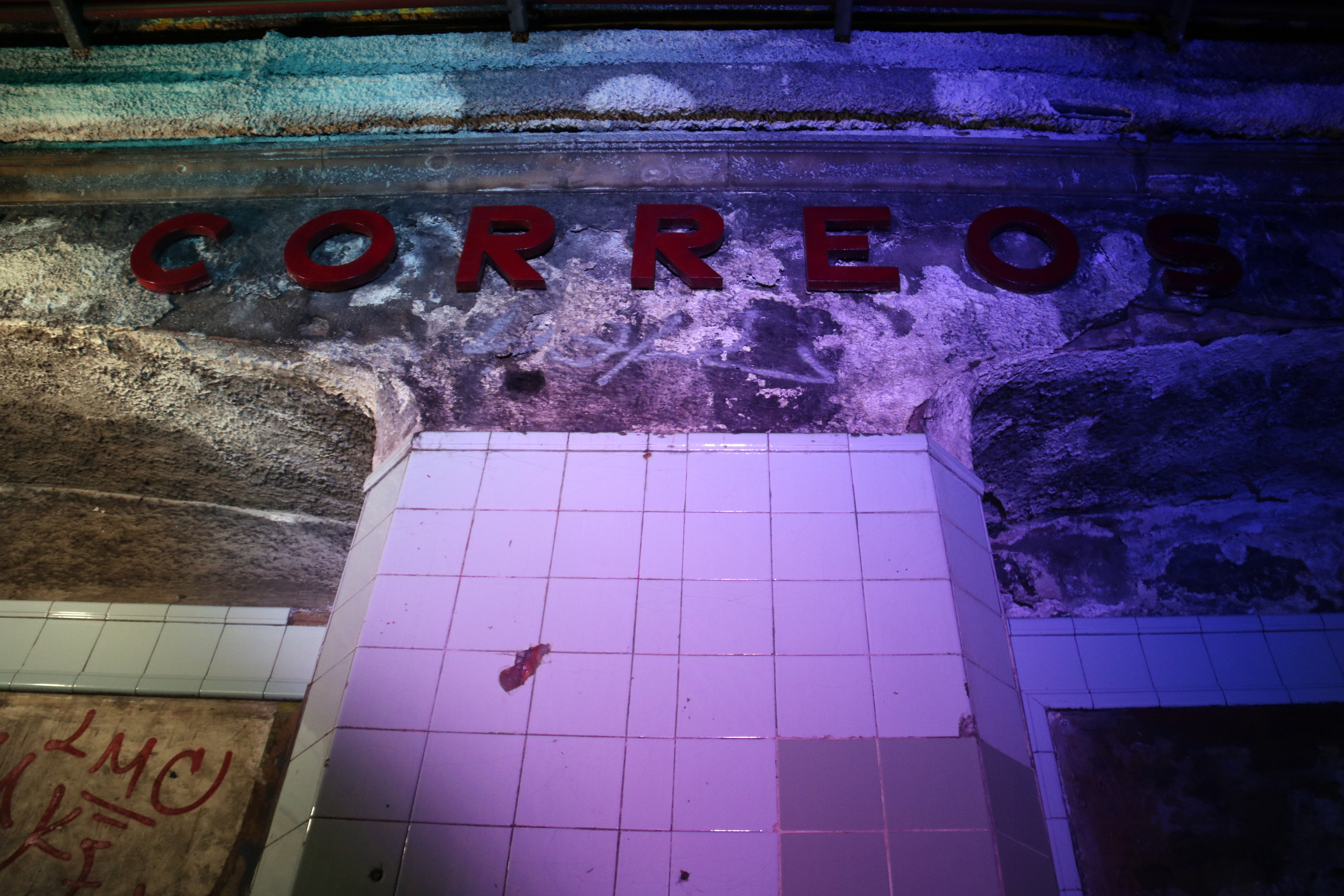 The old poster of the Correos metro station in Barcelona, now part of the L4 yellow metro line