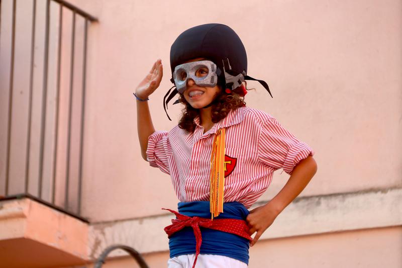 A child wears new casteller human towers protective equipment