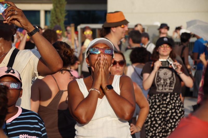 A woman views the eclipse in Tarragona