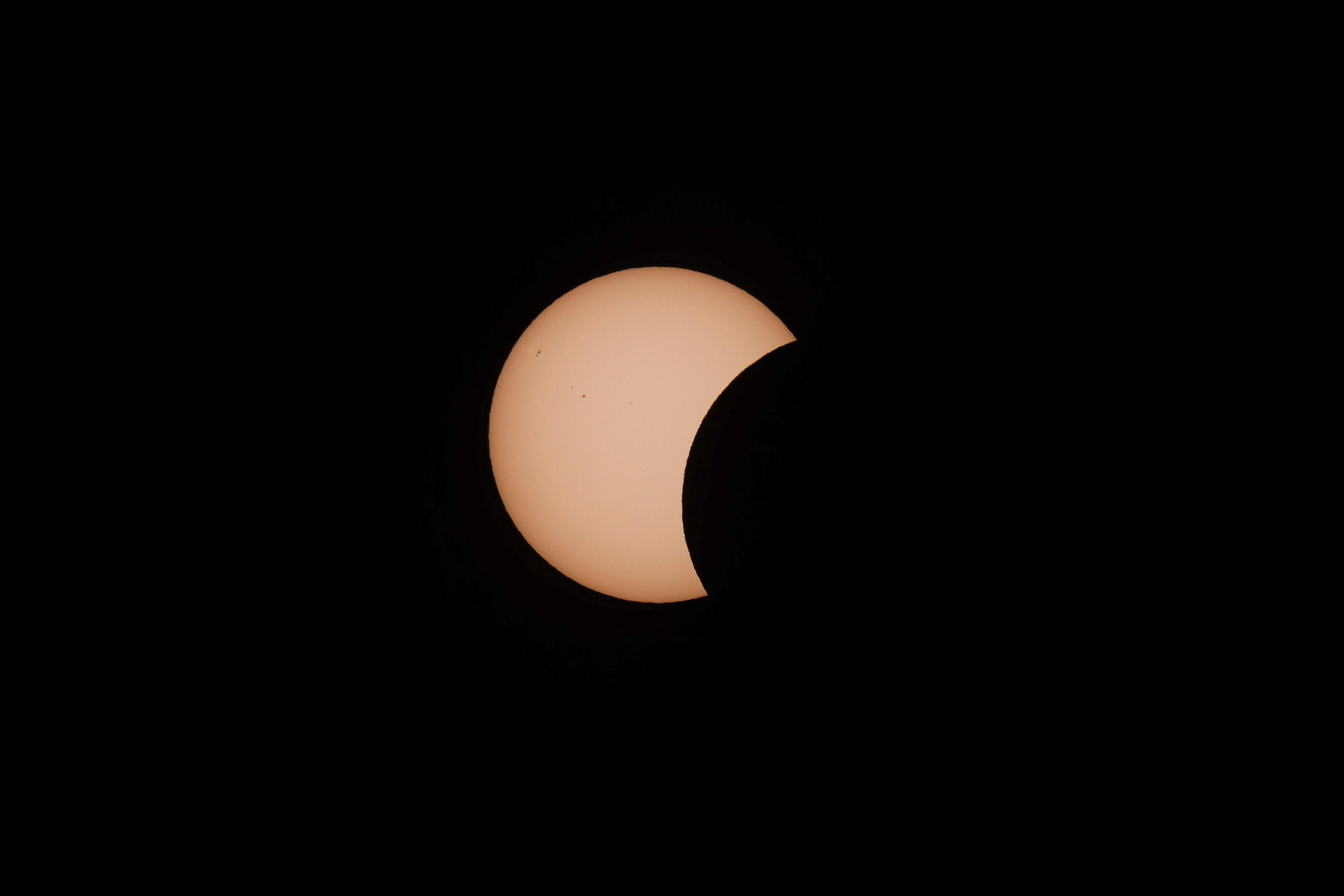 The sun partially obscured by the moon at the start of the total solar eclipse in Catalonia, in La Granadella
