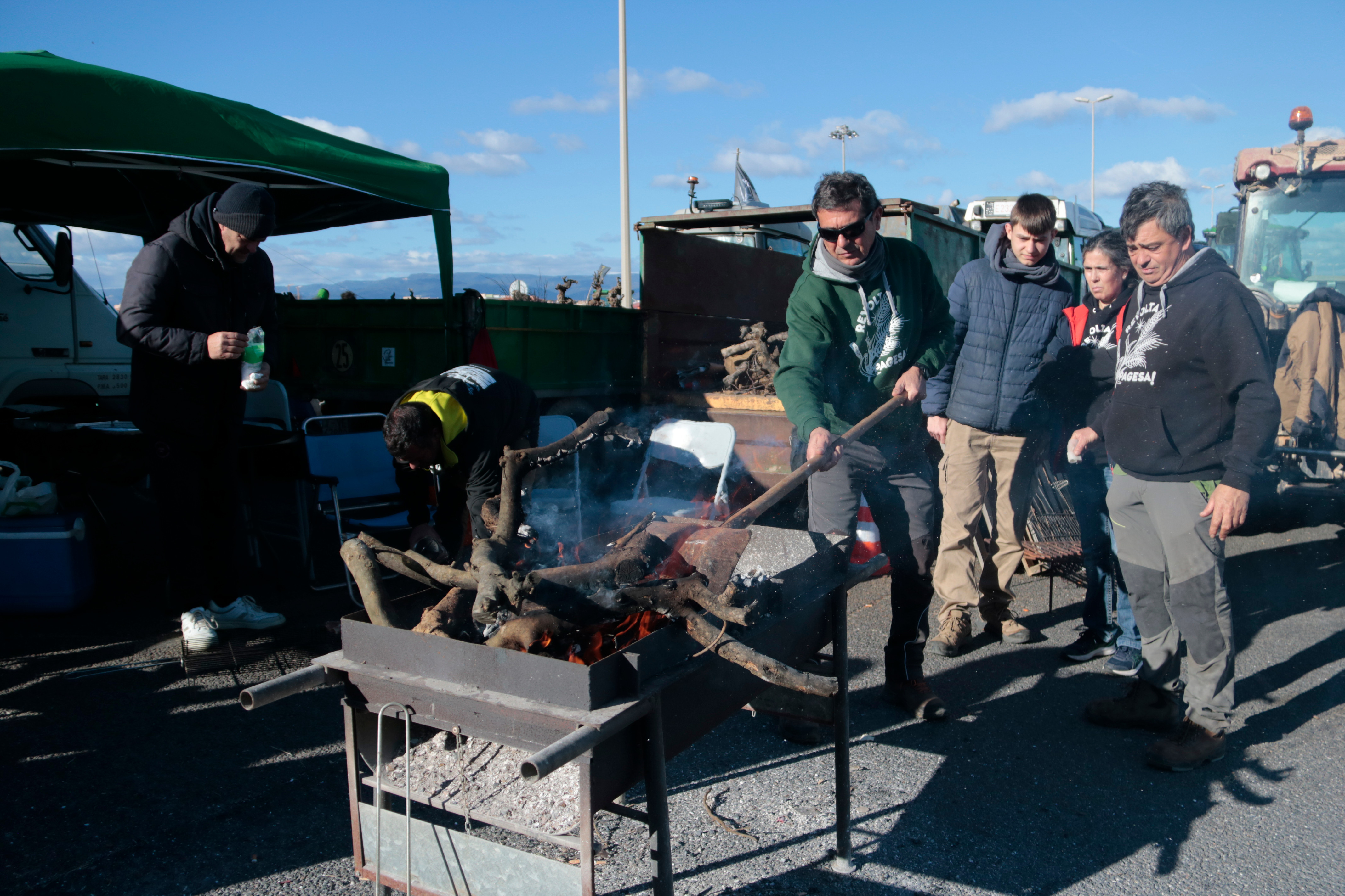 Protesting farmers cook lunch on one of the blocked roads