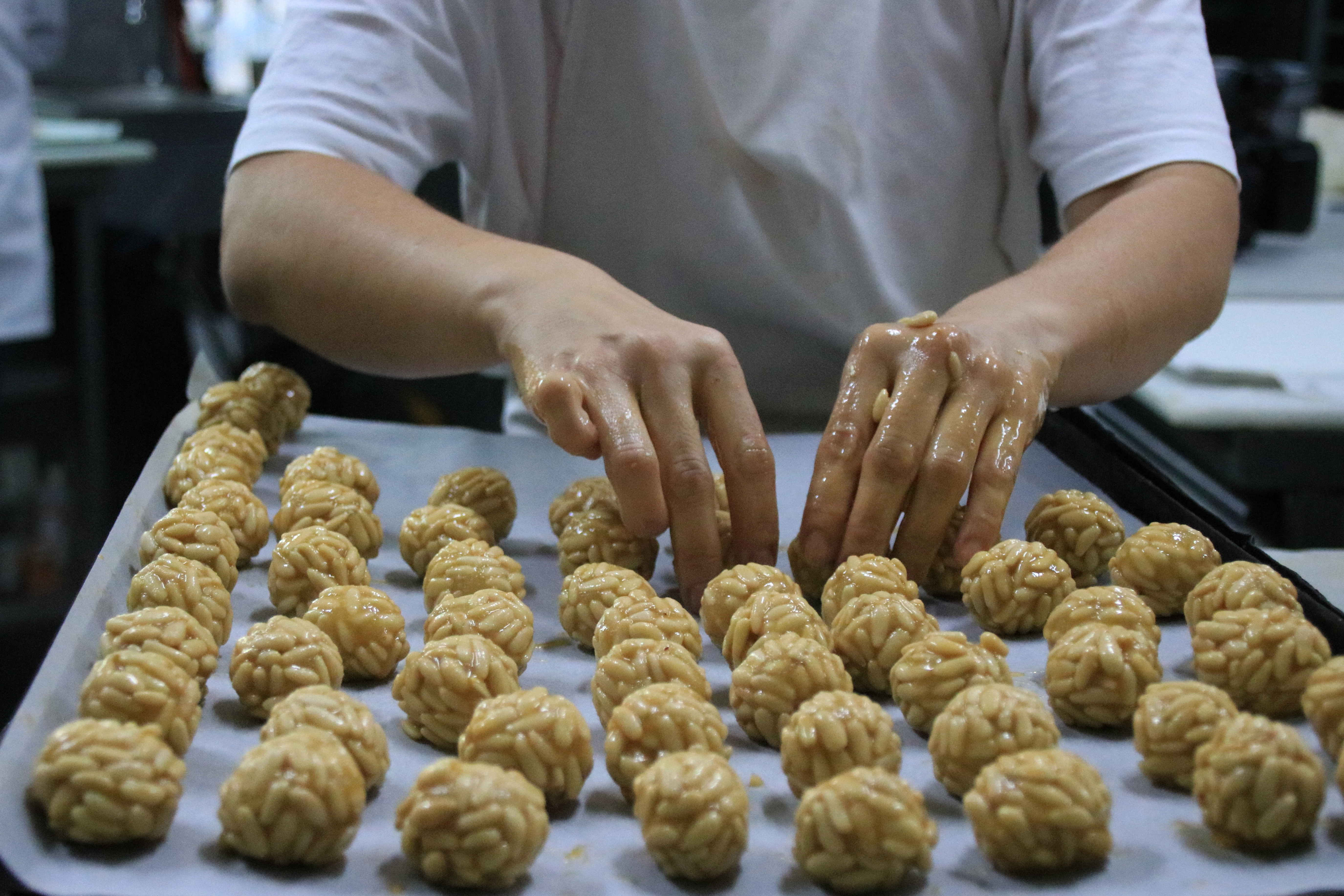 A baker prepares 'panellets' ahead of 2023 Castanyada