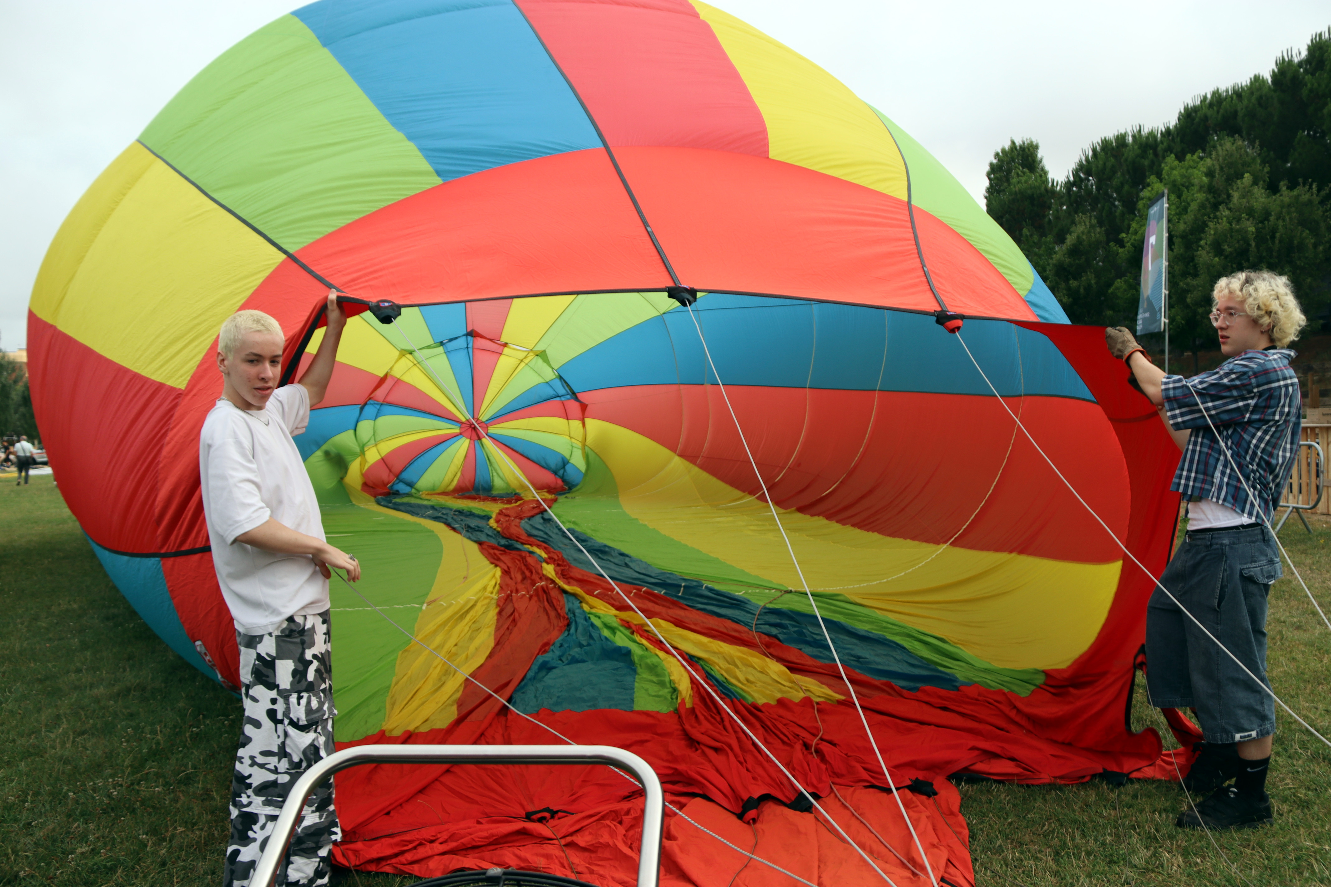Pilots inflate hot air balloons