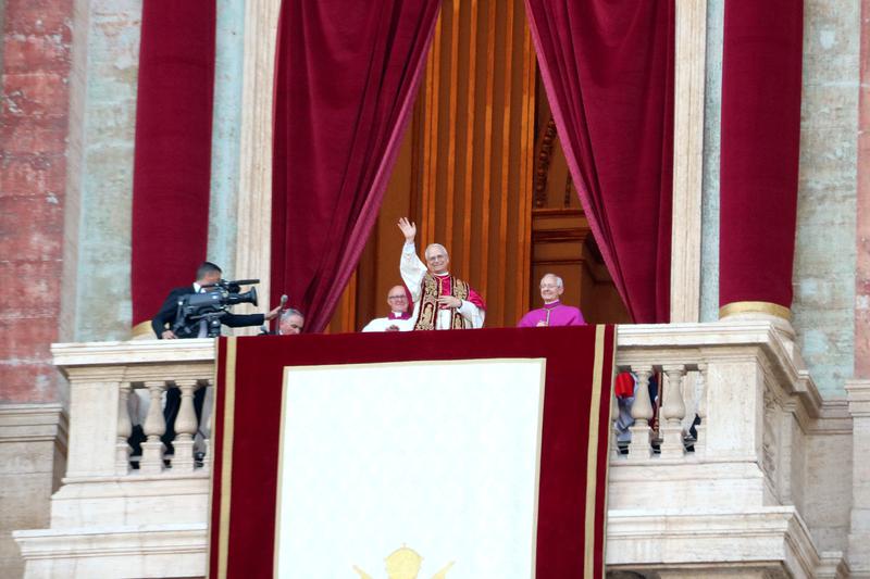 Pope Leo XIV greets the crowd from the balcony of St Peter's Basilica for the first time shortly after being elected Pope