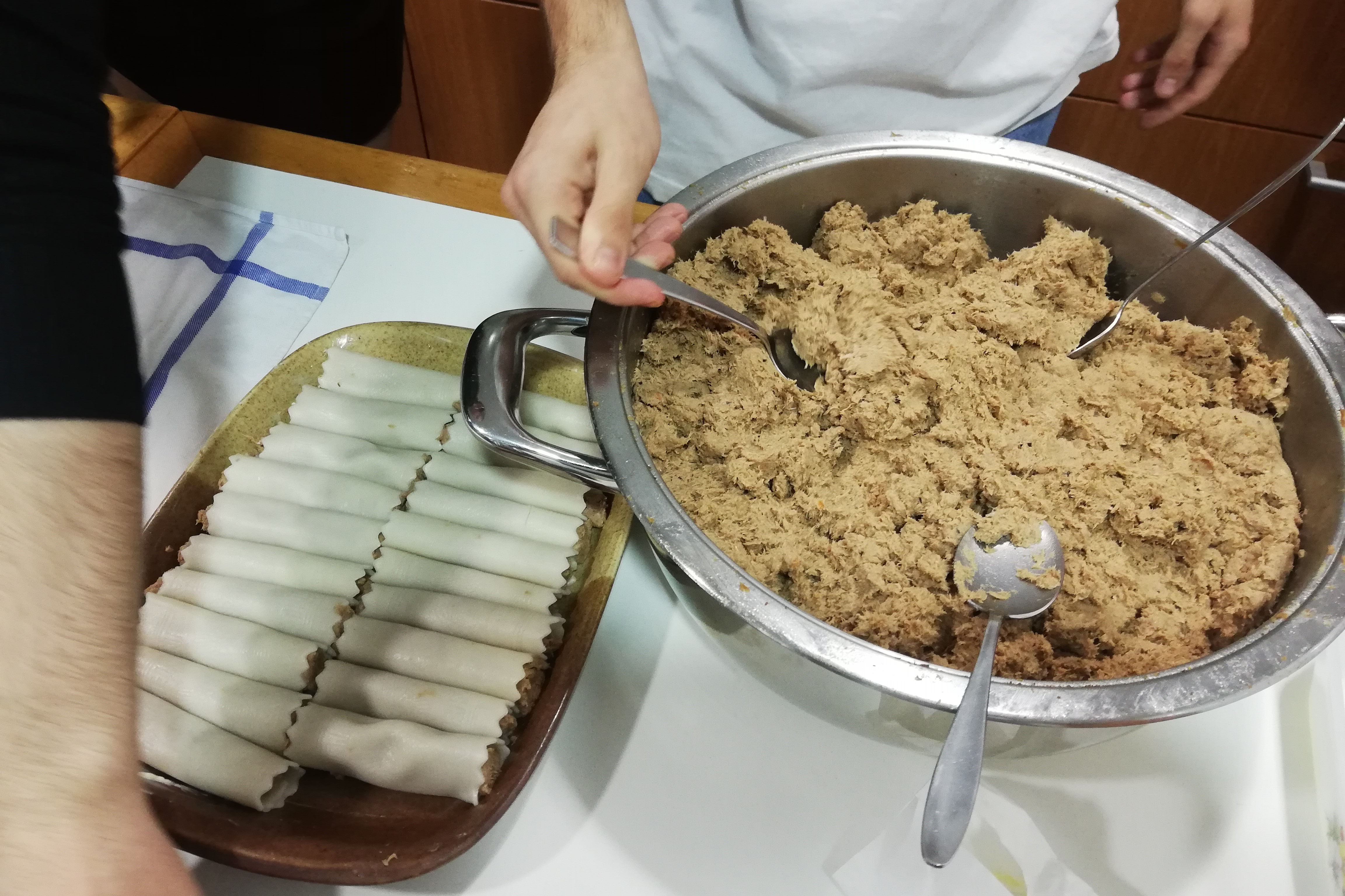 A family prepares canelons for Sant Esteve, Catalonia's classic post-Christmas comfort dish