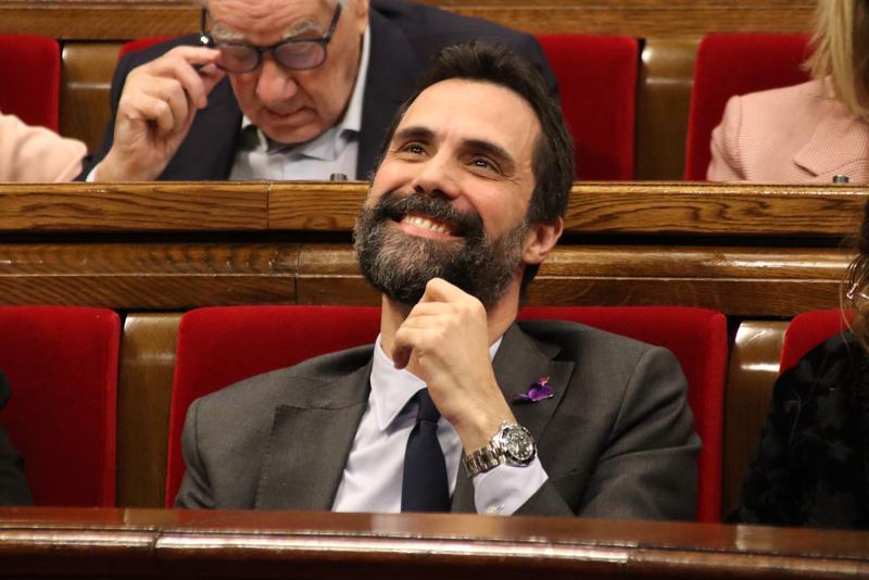 Former parliament speaker Roger Torrent smiles upon hearing the verdict of the Catalan High Court on November 23