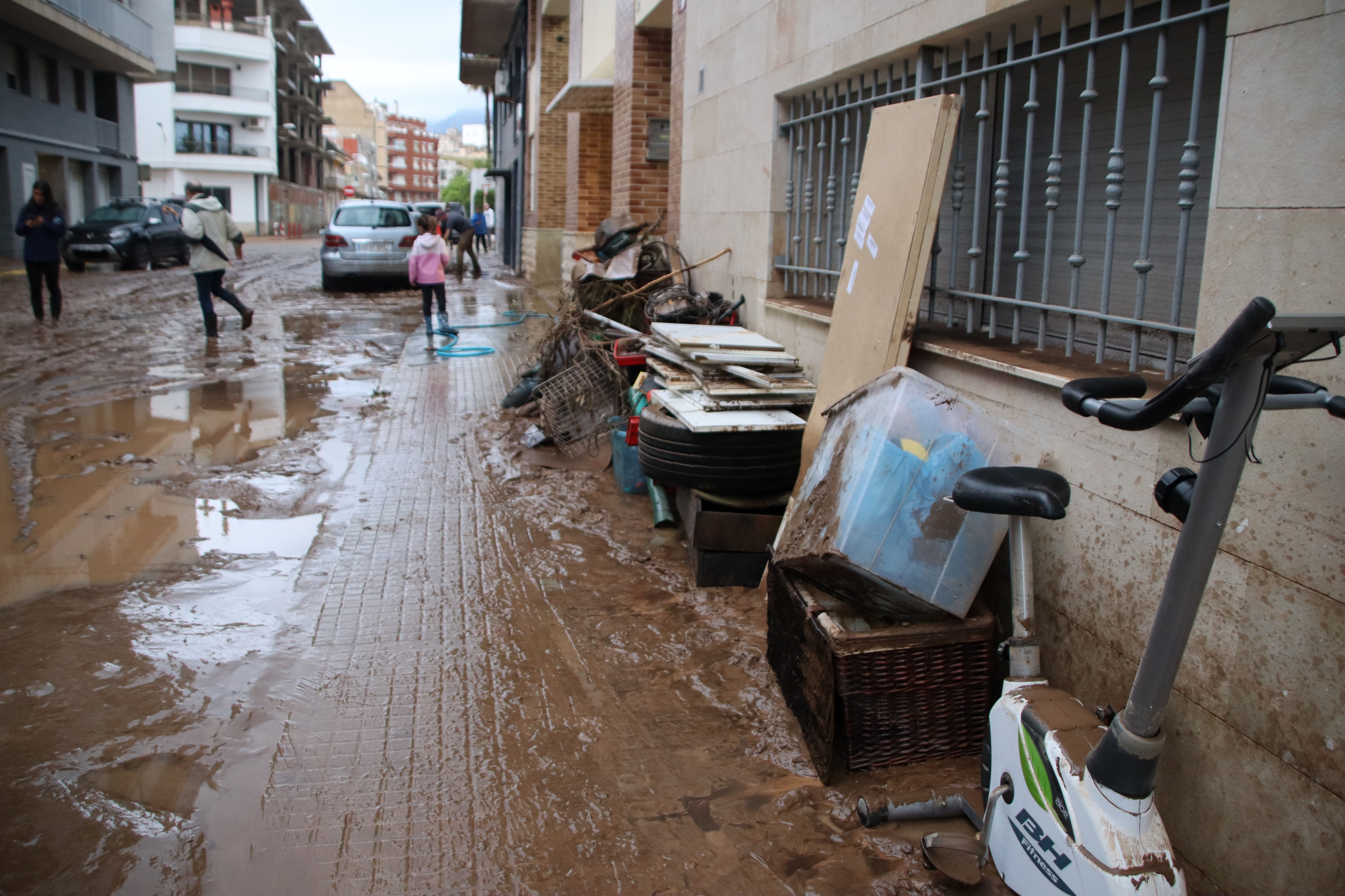 The Mendez Núñez Street in La Ràpita with mud after severe storm on October 13, 2025