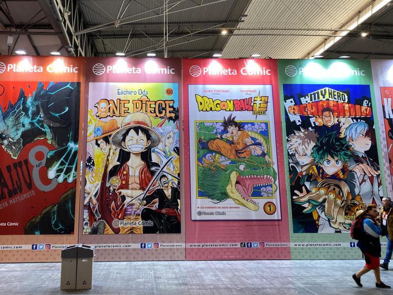 Posters at Manga Barcelona for popular anime series One Piece, Dragon Ball, and My Hero Academica