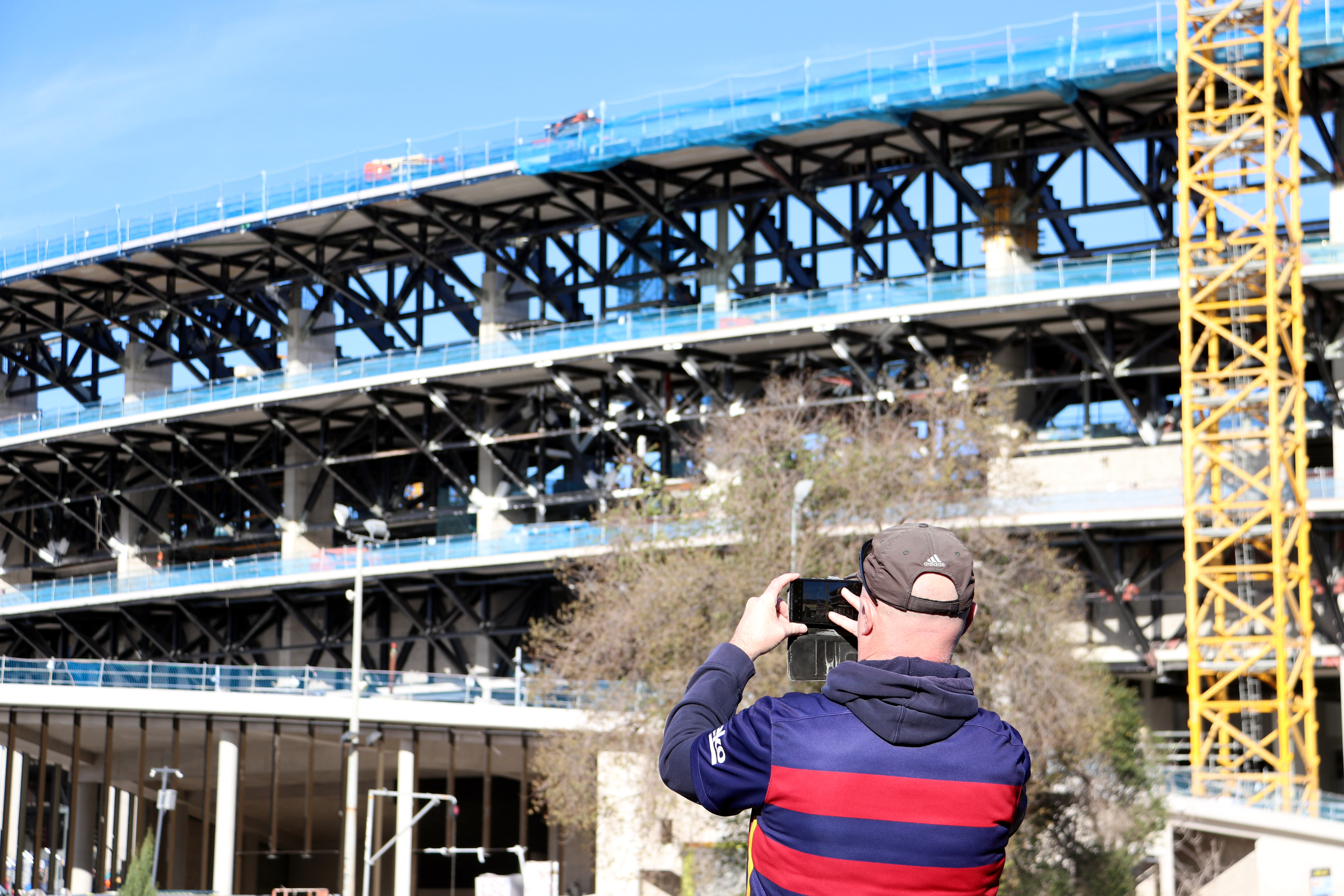 Barça fan takes a picture of the Spotify Camp Nou, still under construction