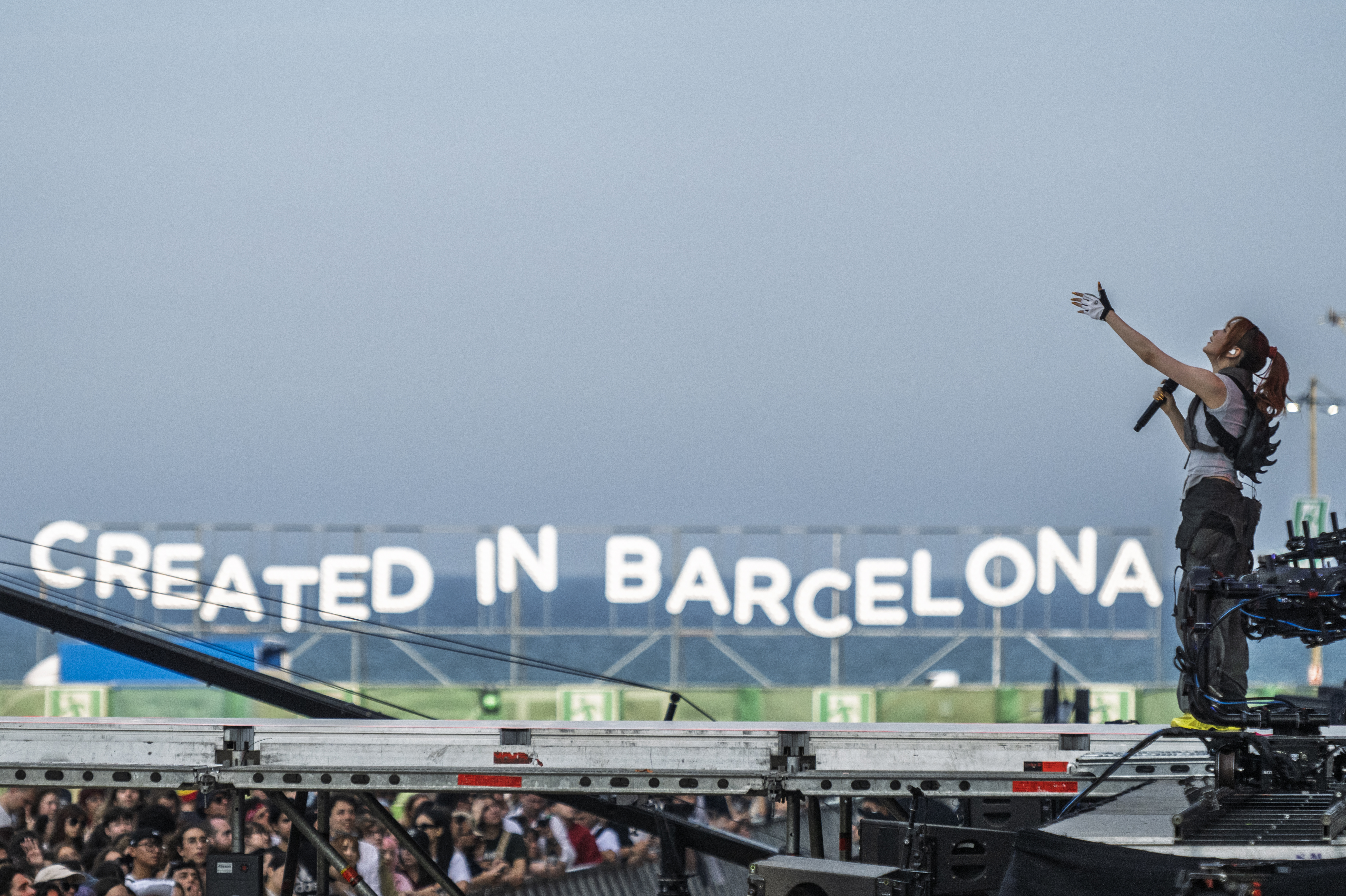 Japanese group Yoasobi performs in Barcelona's Primavera Sound with their vocalist photographed with the 'Created in Barcelona' slogan