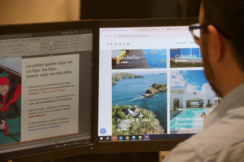 A member of staff working in a travel agency