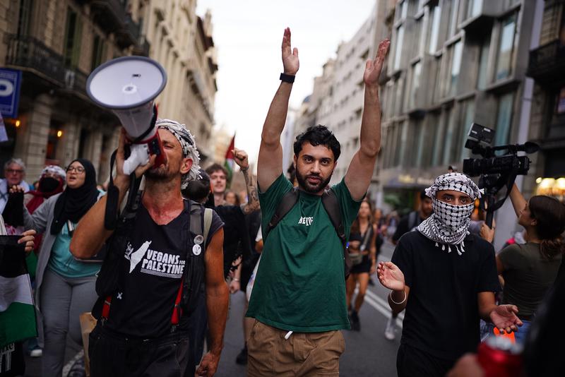 Three protesters at the pro-Palestine rally in Barcelona