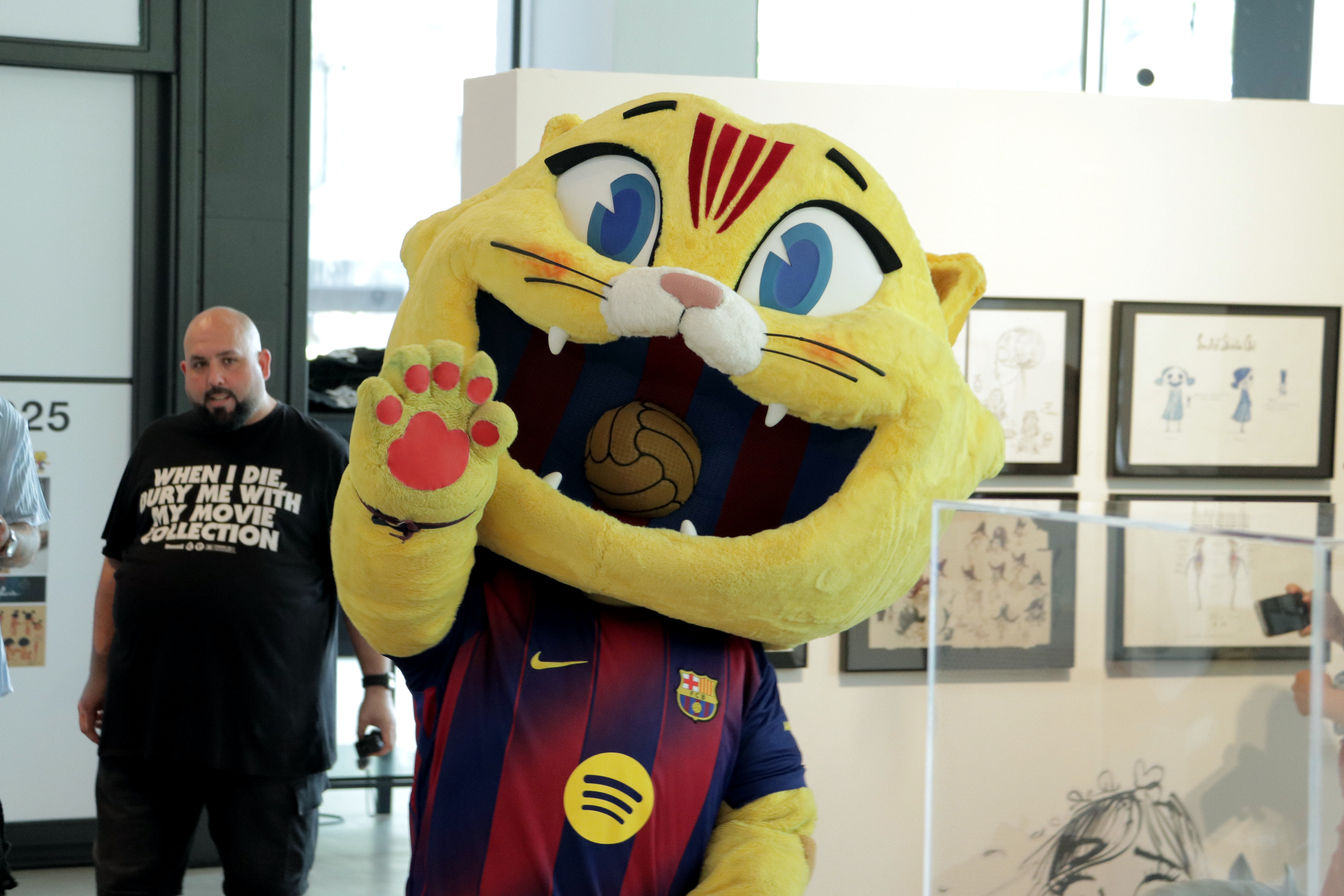 FC Barcelona mascot CAT designed by Grangel Studio waves during an exhibition at Casa Seat
