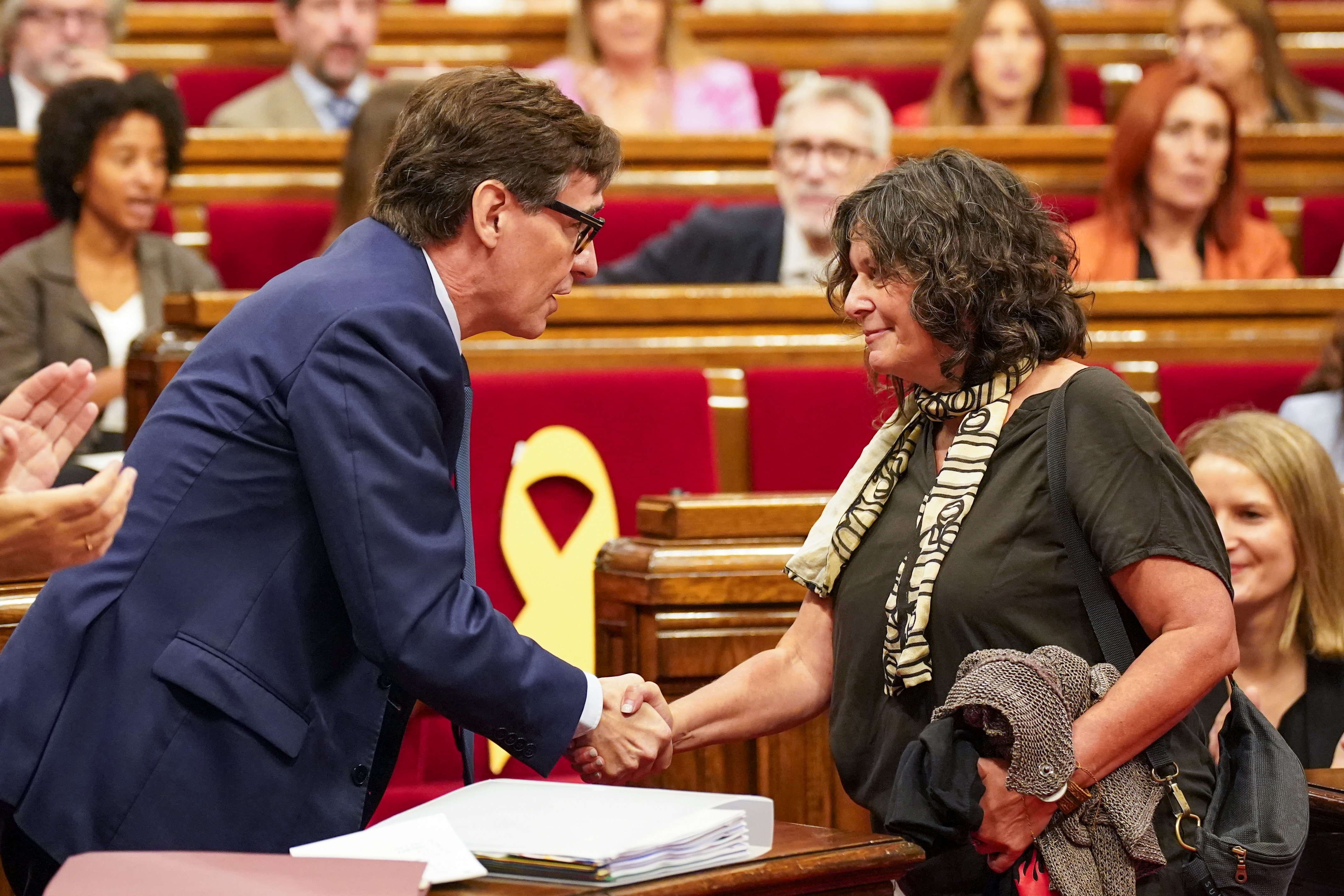 Catalan president Salvador Illa greets CUP MP Pilar Castillejo following her return from Israel, after taking part the Gaza aid flotilla