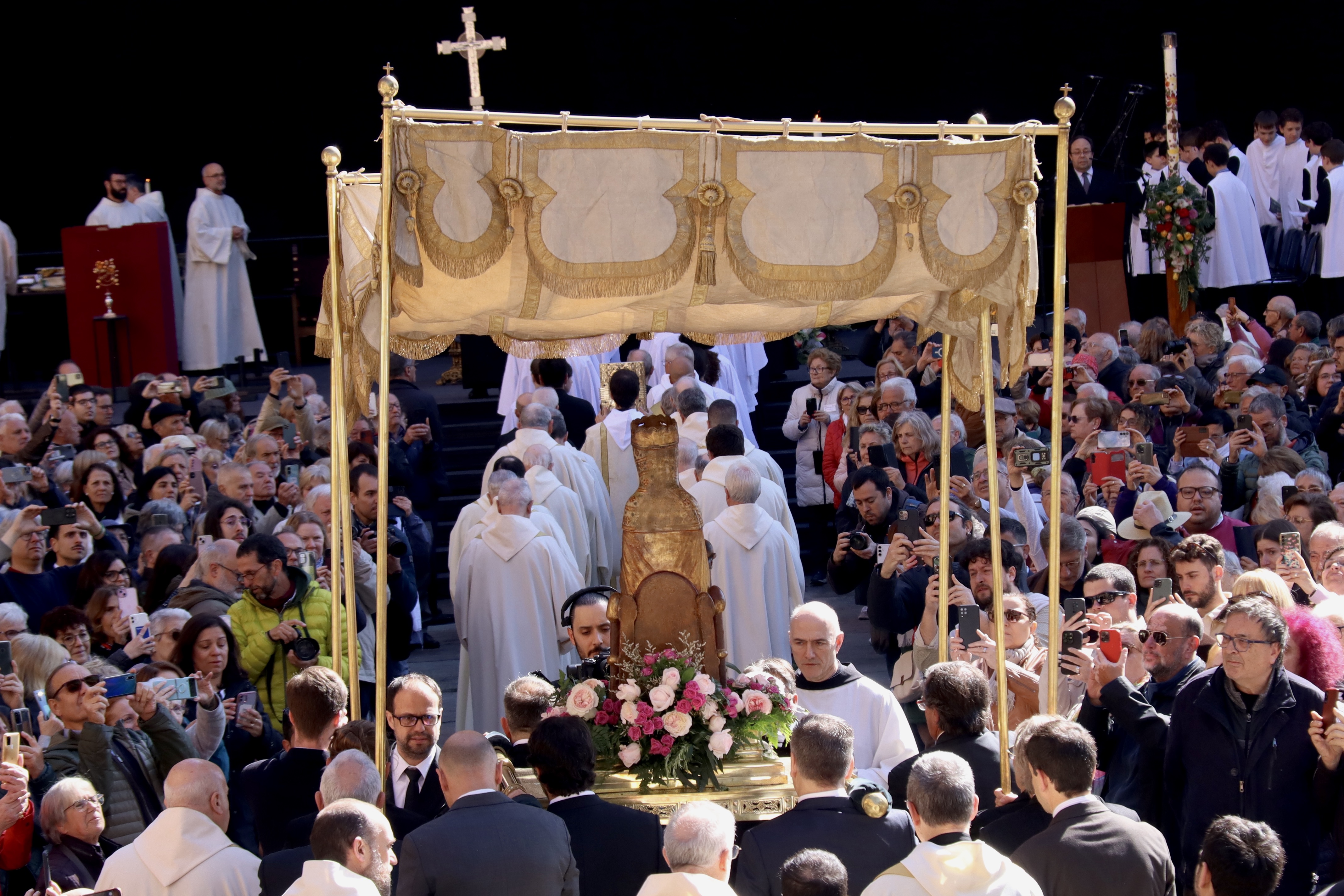 Thousands watch La Moreneta, an iconic curved sculpture of a black Madonna representing the Virgin of Montserrat, as it leaves the basilica for the first time in decades on April 27, 2025
